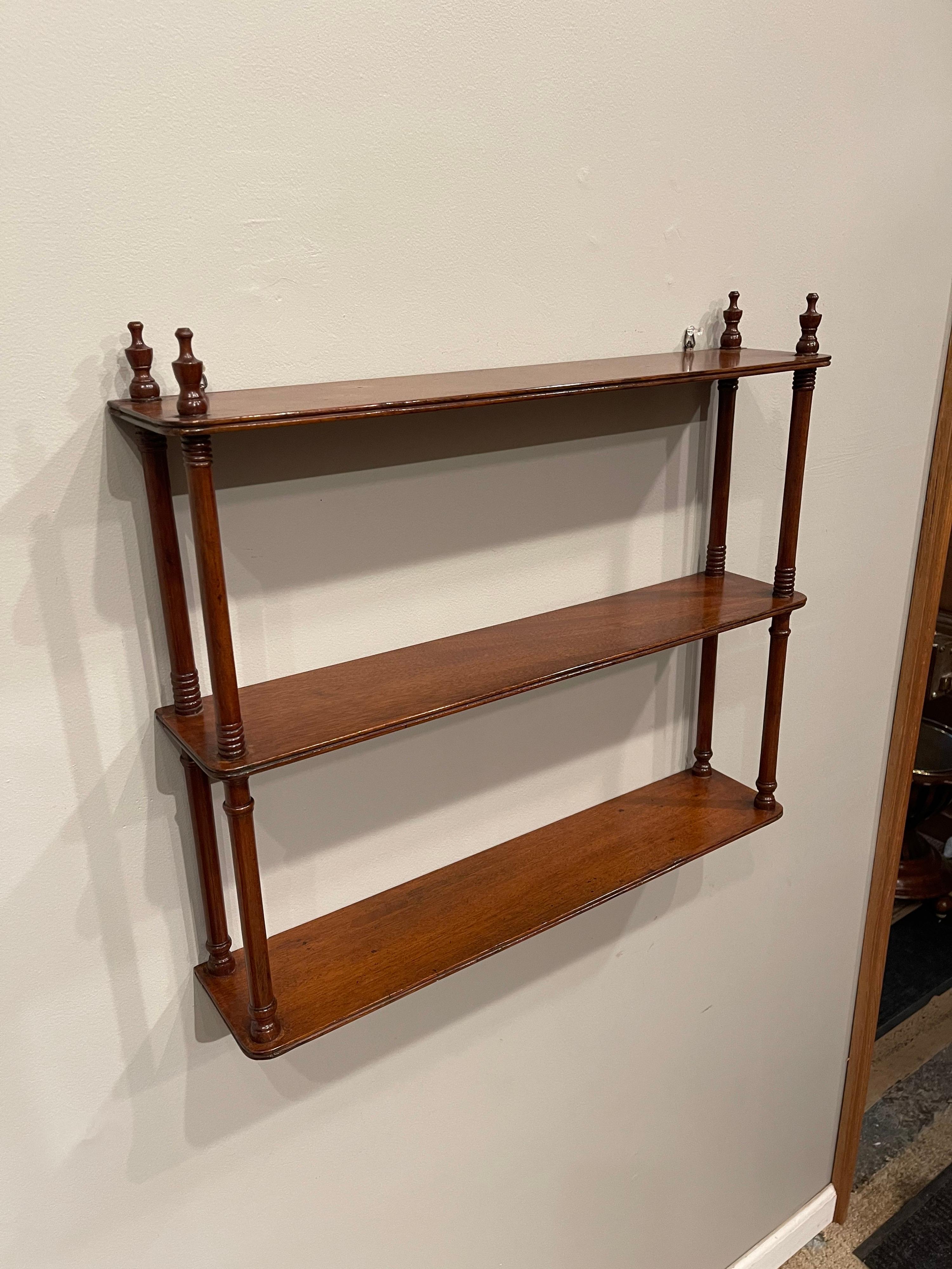 Small mahogany hanging wall shelf. 
Cleaned & tighten. Touched up & polished ready for use.