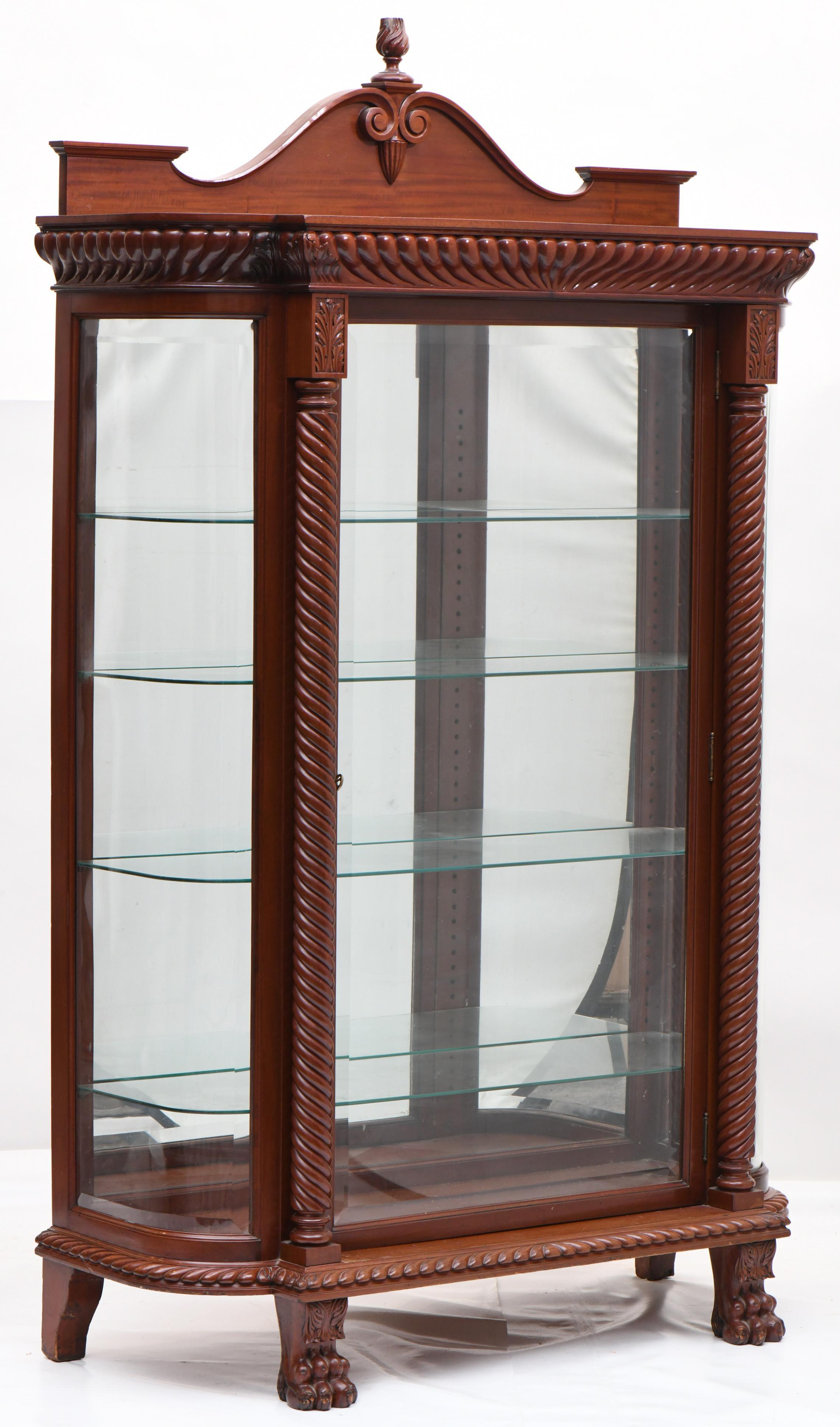 Elevate your home with this 19th Century Horner & Co Hand-Carved Mahogany Wood China Cabinet, an exceptional piece of furniture designed with the utmost attention to detail and craftsmanship. This china cabinet is not just a functional piece; it's a