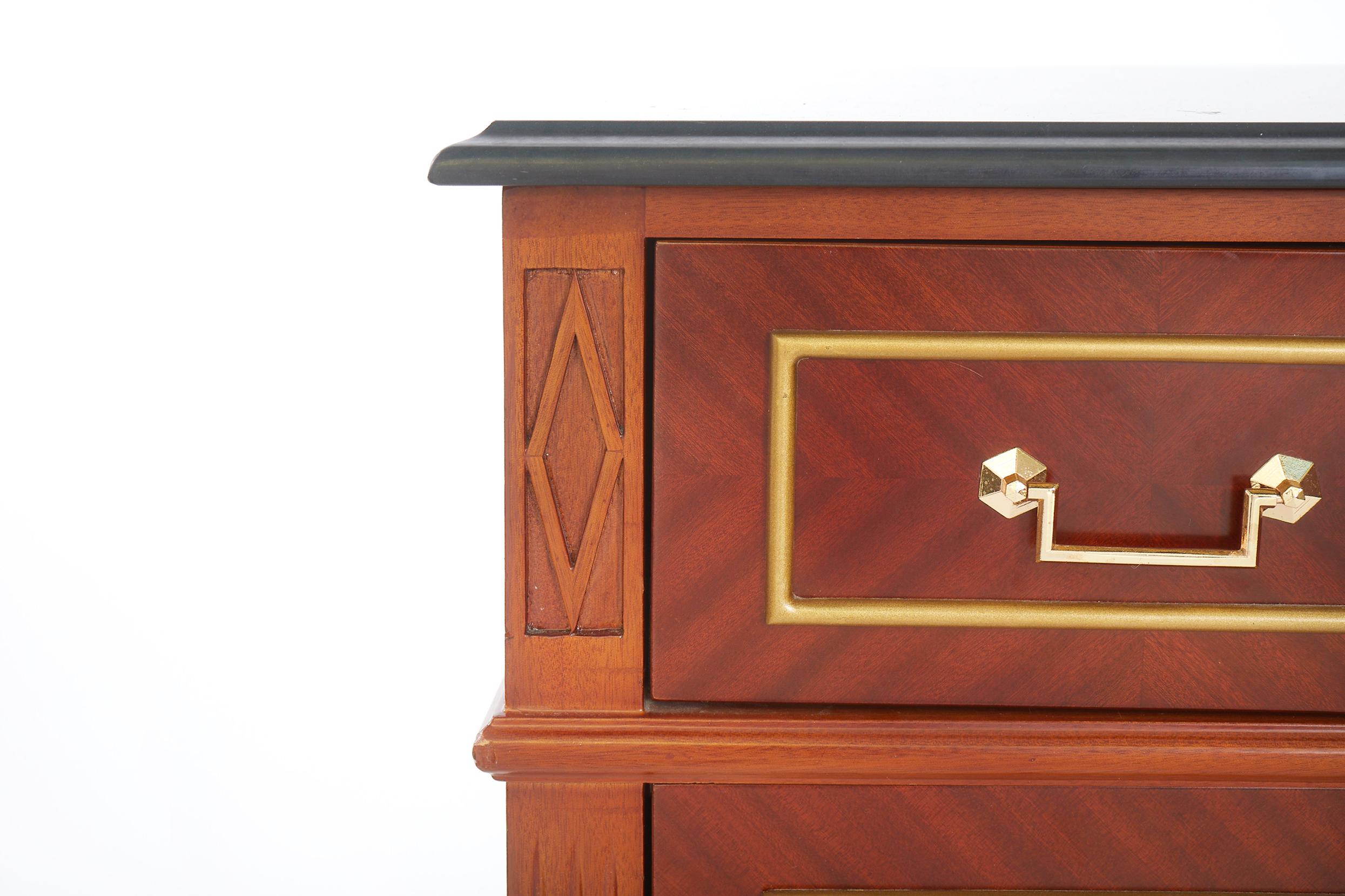 Early 20th century mahogany wood Hollywood Regency style commode / bureau chest with marble top and gilt brass design details. The commode is in great condition with minor wear appropriate to age / use. Marble top is attached. The commode / bureau