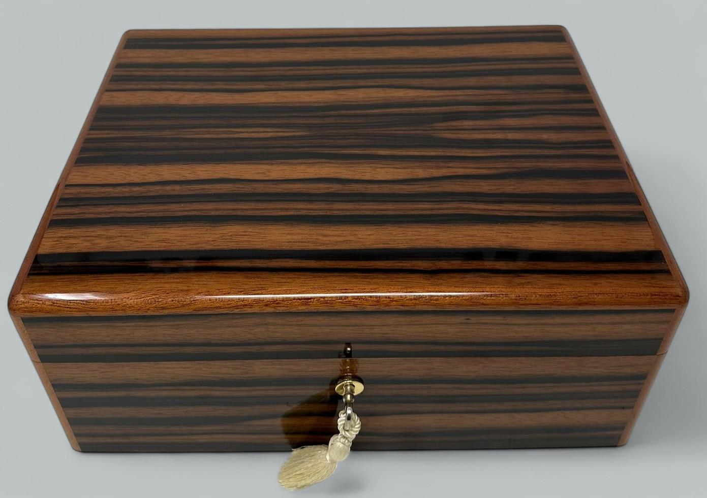 Absolutely Stunning Ladys or Gentlemans Jewellery Casket of outstanding quality and of generous size, made in Ireland by renowned cabinet makers Mannings of Ireland, using well figured Burl Walnut   

This box is constructed using the finest flame