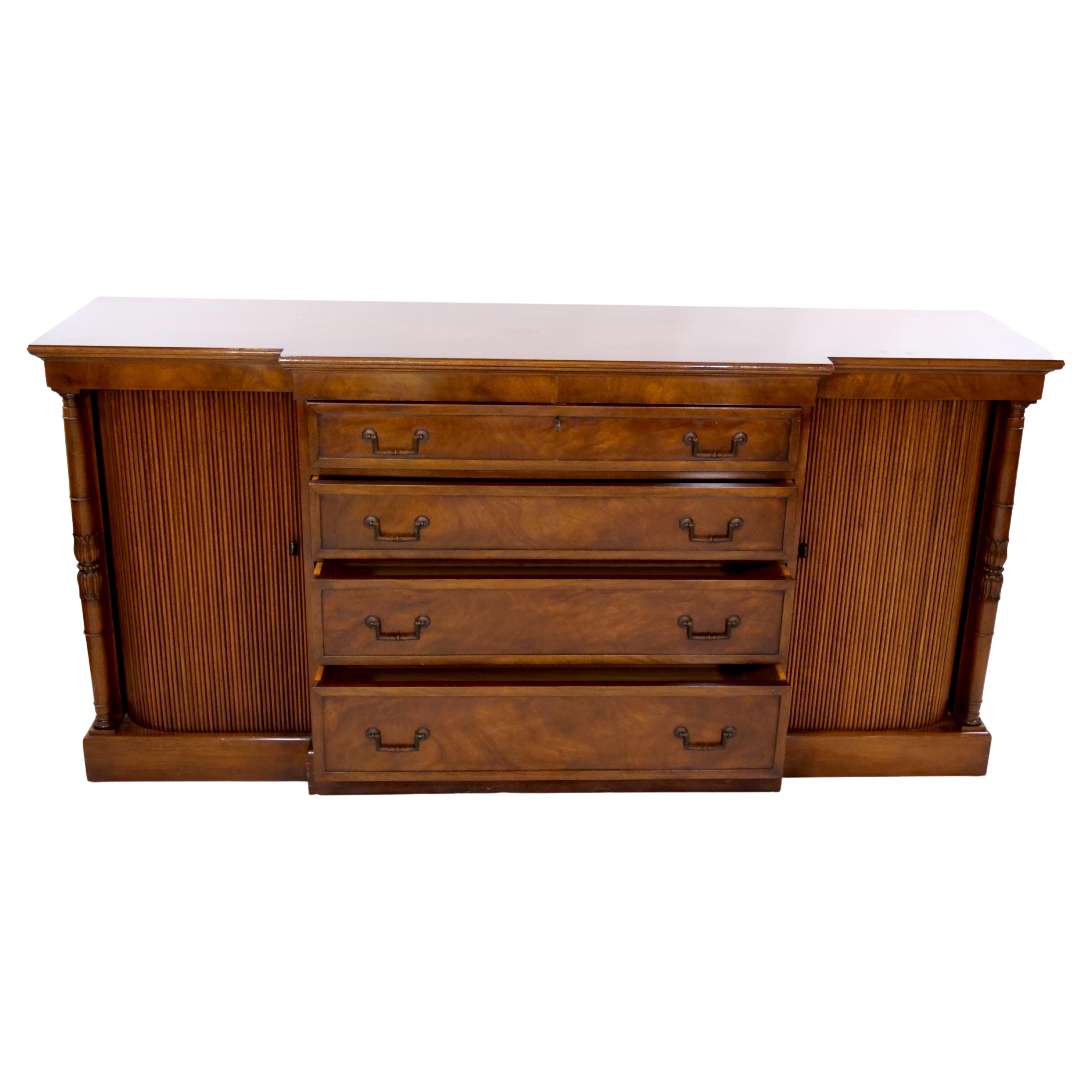 Beautifully hand crafted mahogany wood sideboard / credenza with two side doors and four pull front drawer with brass detail and key. The sideboard is very handsome and beautifully hand  crafted. The sideboard is in great condition. Minor wear