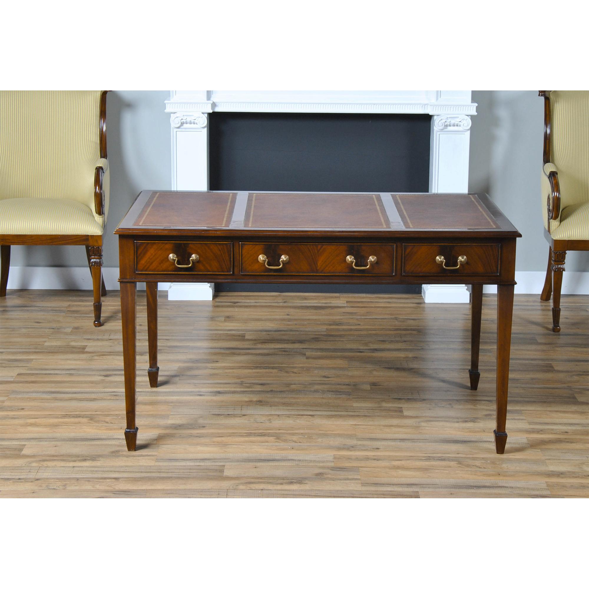 An elegant Mahogany Writing Table by Niagara Furniture which is a perfect fit for use either at home or in the office. Features include a three panel brown genuine leather tooled top, made from full grain genuine leather, solid mahogany molded edge