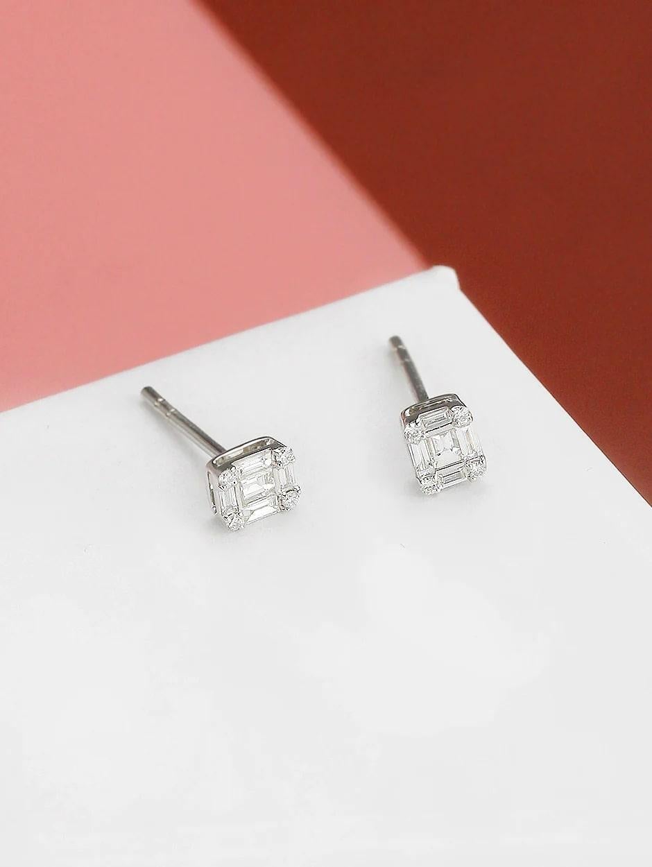 Combination of pave and baguette white diamond stud earring, all with a high polish finish. Available in 18K White Gold.

Earring Information
Diamond Type : Natural Diamond
Metal : 18K
Metal Color : White Gold
Diamond Carat Weight :