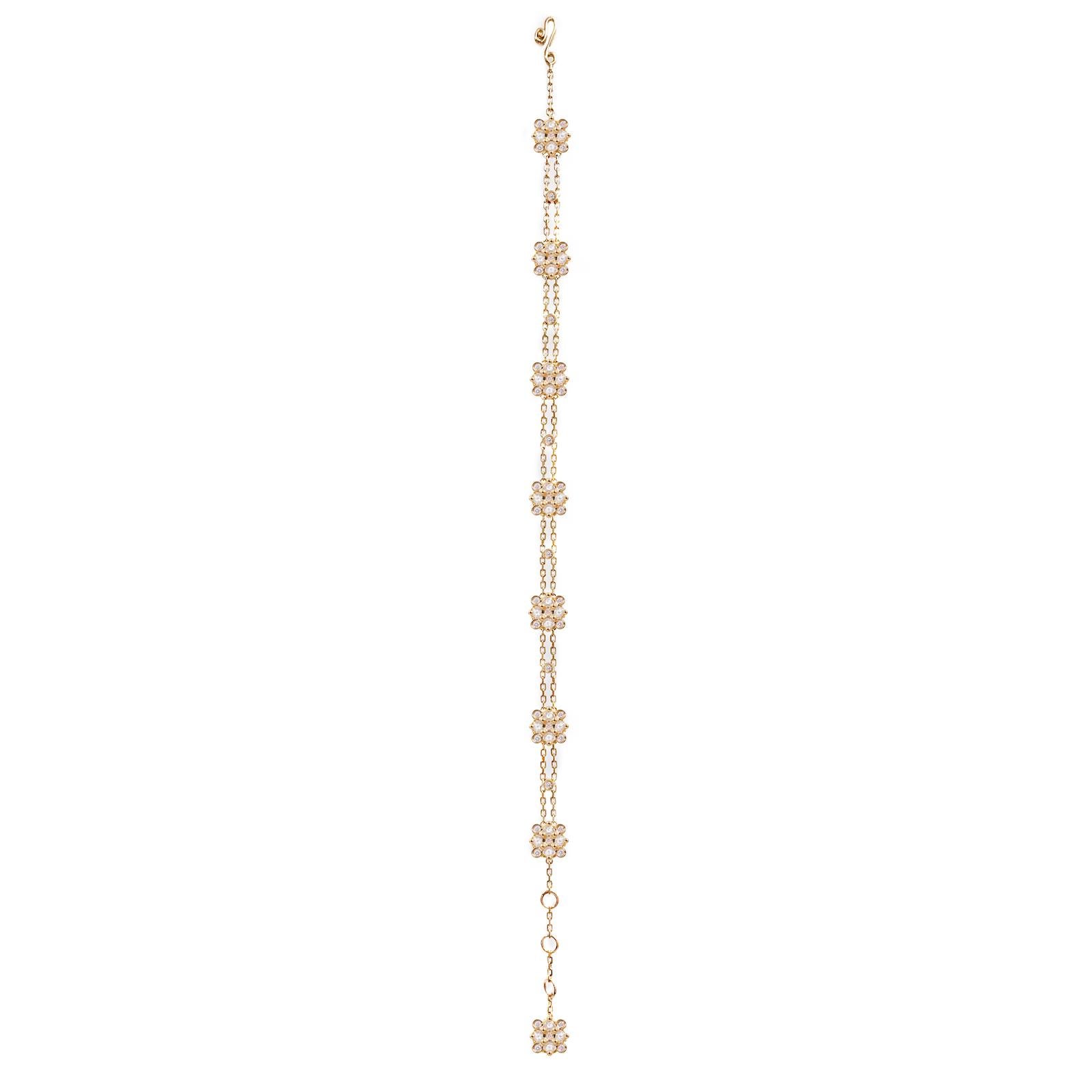 The Maia diamond square checker station bracelet drapes around your wrist like a soft ribbon. It features 7 stations of rose and brilliant cut diamonds that are arranged in a square checkered cluster. They're set on two strings of delicate cable