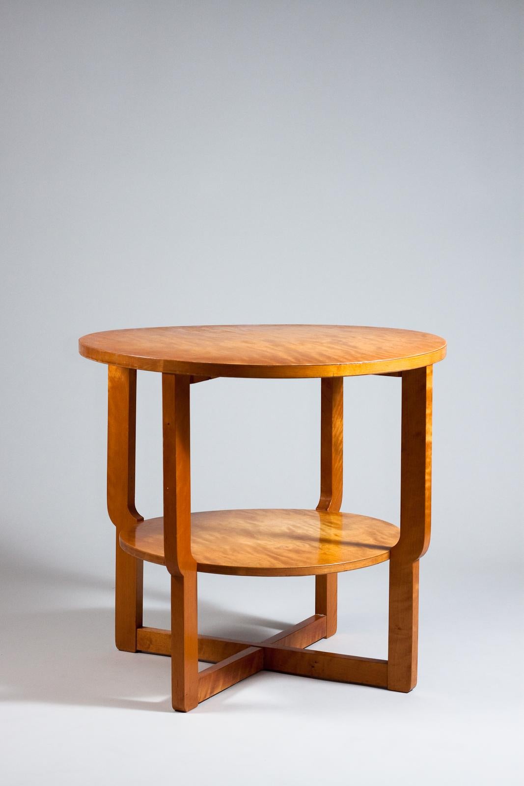 Introducing the Maija Heikinheimo, 1930's occasional table in birch - a delightful addition to any vintage designer furniture collection. Expertly crafted and finished in a striking birch tone, this stylish table is perfect for adding a touch of
