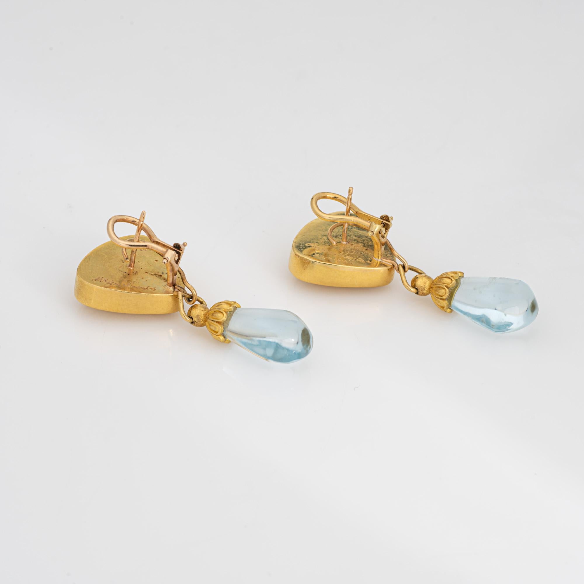 Stylish Maija Neimanis aquamarine earrings crafted in 22k & 18k yellow gold.

Cabochon aquamarines measure 15mm x 12mm. The aquamarines are in very good condition and free of cracks or chips.  

Maija Neimanis was a renowned jewelry designer known