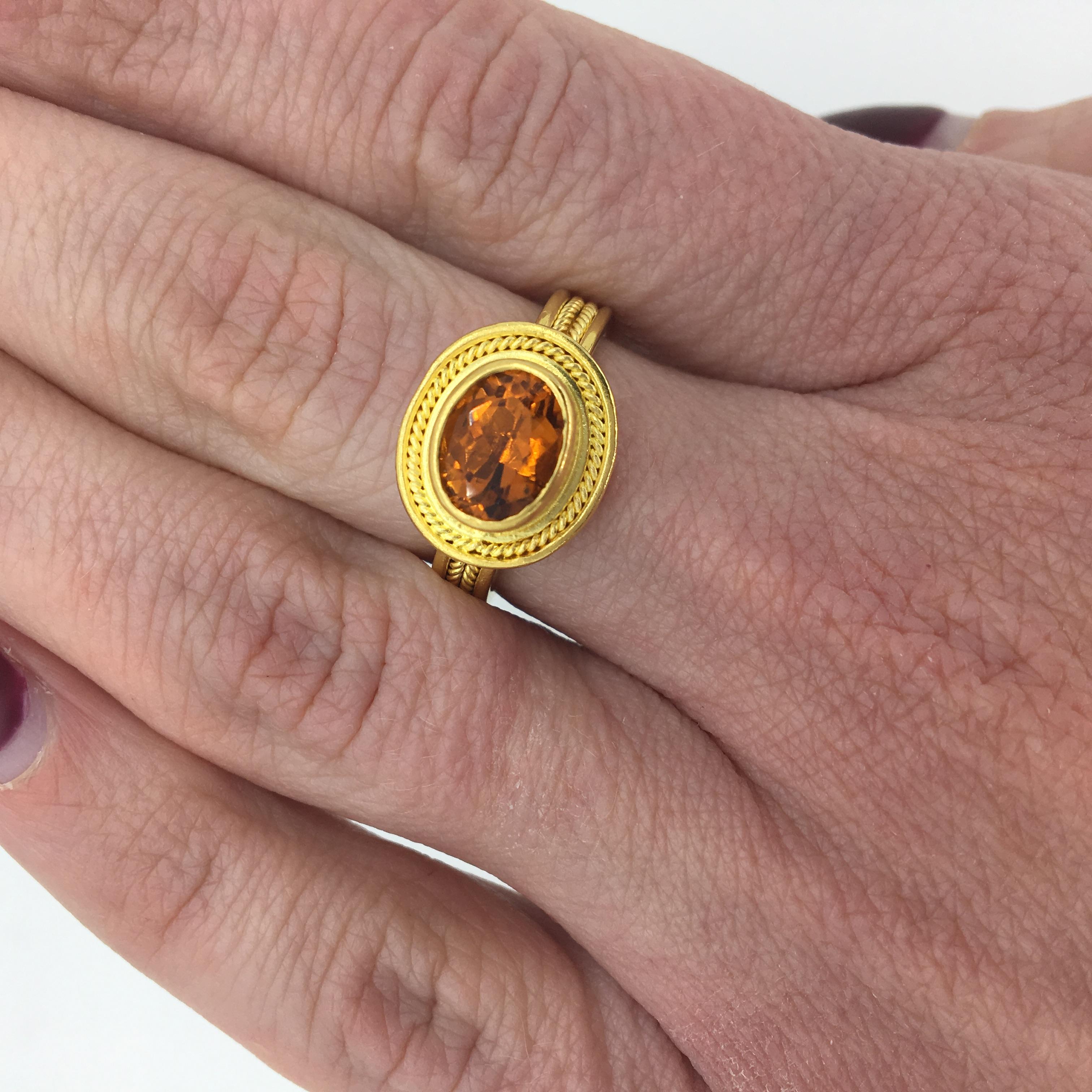 Stunning 22K yellow gold designer Maija Neimanis ring with a beautiful rope designed bezel and shank.

Designer: Maija Neimanis
Gemstone: Oval Cut Citrine
Gemstone Carat Weight: Approximately 6.11x8.22
Metal: 22K Yellow Gold
Ring Size: