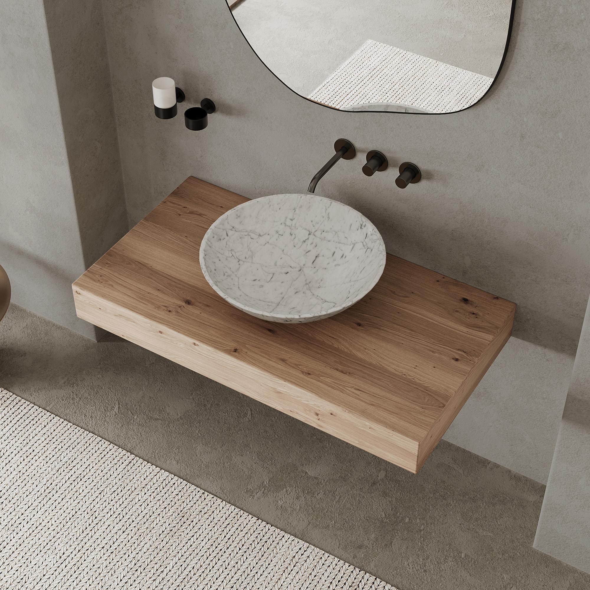 Our honed marble basin seamlessly blends classic charm with modern style, making it an ideal choice for elevating your bathroom into a refined and curated space. Crafted with the timeless elegance of natural marble, its round design exudes