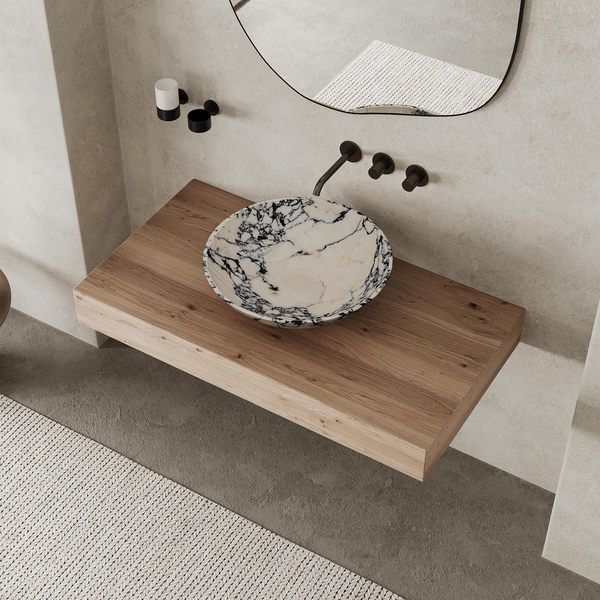 Our honed marble basin seamlessly blends classic charm with modern style, making it an ideal choice for elevating your bathroom into a refined and curated space. Crafted with the timeless elegance of natural marble, its square design exudes