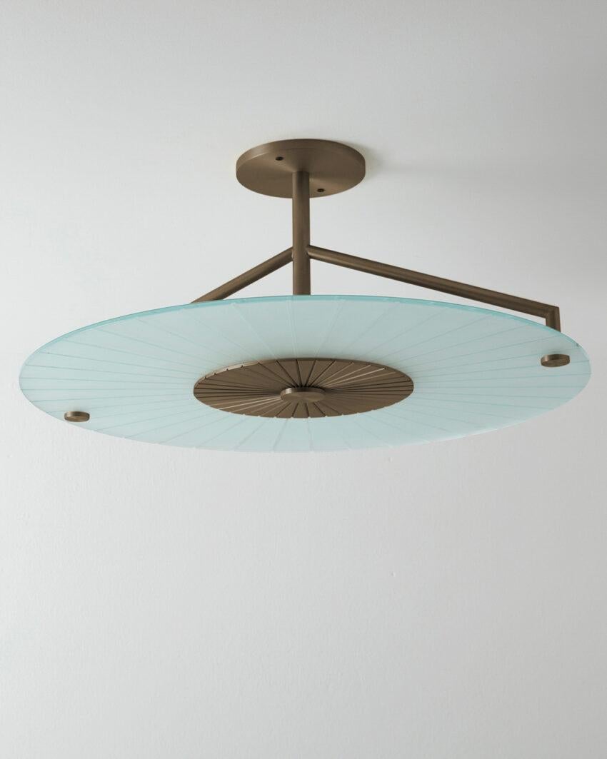 Maiko Brushed Bronze Ceiling Mounted Lamp by Carla Baz
Dimensions: Ø 63 x H 27 cm.
Materials: Brushed bronze and clear glass.
Weight: 8 kg.

Available in verdigris metal, brushed brass, copper or bronze finishes. Please contact us. 

Maiko lighting