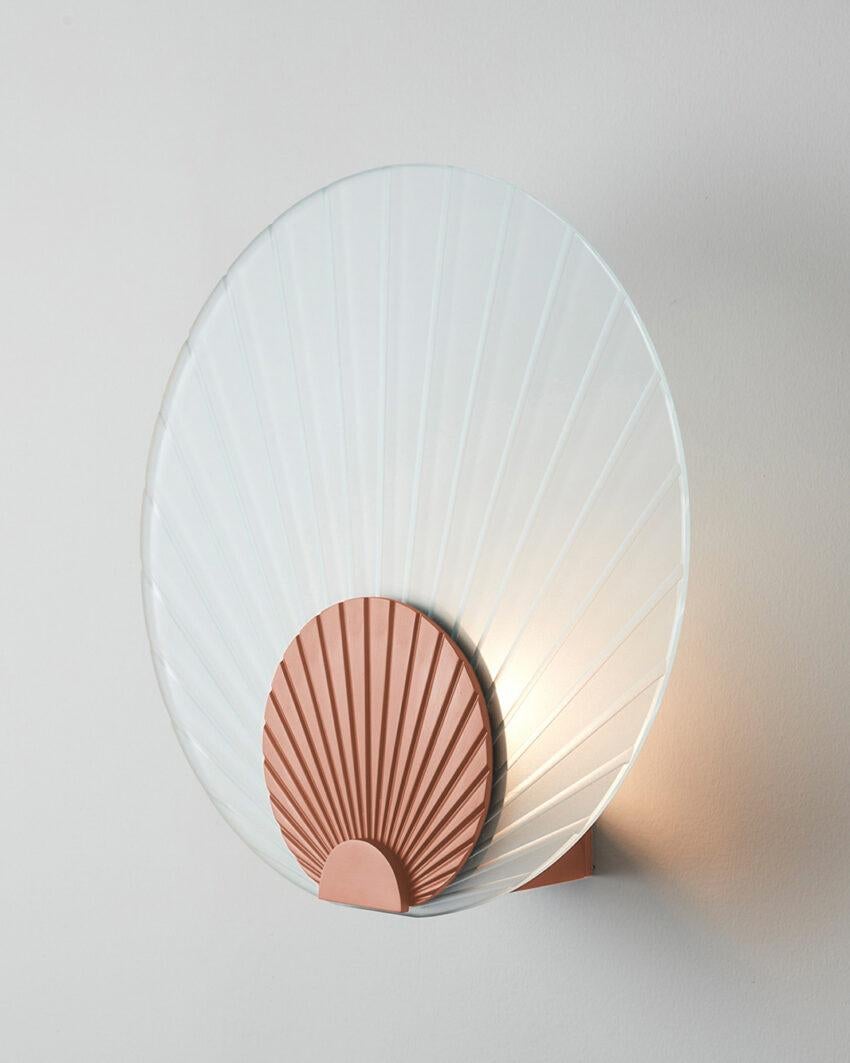 Maiko Clear Glass And Brushed Copper Wall Mounted Lamp by Carla Baz
Dimensions: Ø 35 x D 14 cm.
Materials: Brushed copper and clear glass.
Weight: 3,5 kg.

Available in different finishes: verdigris metal, brushed brass, brushed copper, brushed