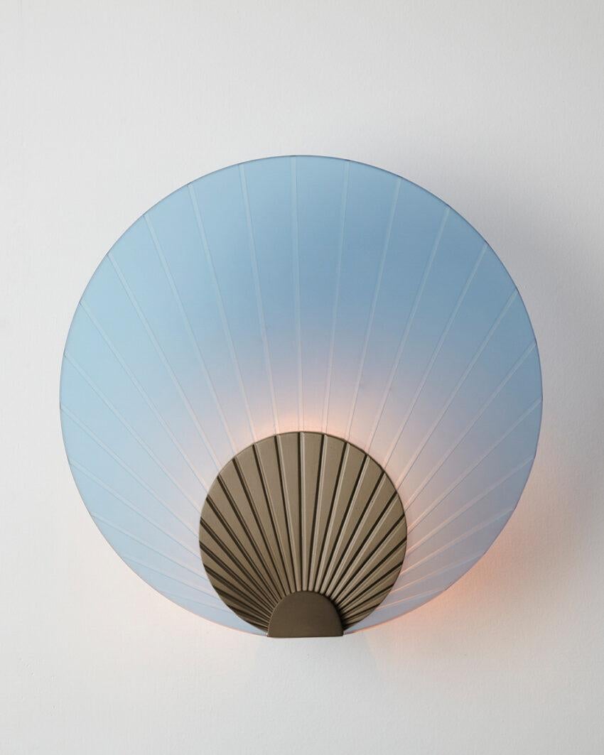 Maiko Indigo Glass And Brushed Bronze Wall Mounted Lamp by Carla Baz
Dimensions: Ø 35 x D 14 cm.
Materials: Brushed bronze and indigo glass.
Weight: 3,5 kg.

Available in different finishes: verdigris metal, brushed brass, brushed copper, brushed