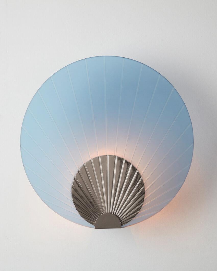 Maiko Indigo Glass And Polished Stainless Steel Wall Mounted Lamp by Carla Baz
Dimensions: Ø 35 x D 14 cm.
Materials: Polished stainless steel and indigo glass.
Weight: 3,5 kg.

Available in different finishes: verdigris metal, brushed brass,