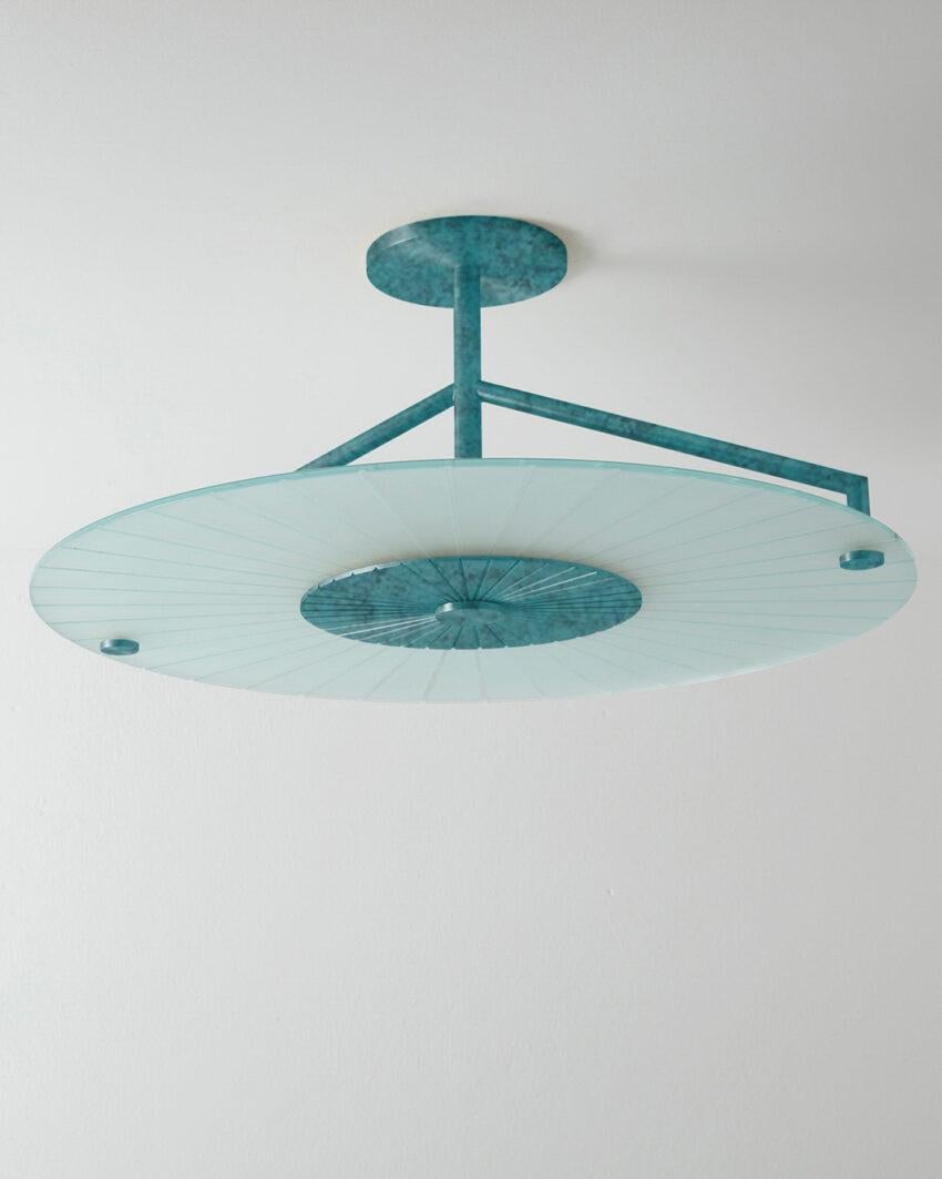 Maiko Verdigris Ceiling Mounted Lamp by Carla Baz
Dimensions: Ø 63 x H 27 cm.
Materials: Verdigris and clear glass.
Weight: 8 kg.

Available in verdigris metal, brushed brass, copper or bronze finishes. Please contact us. 

Maiko lighting pieces are