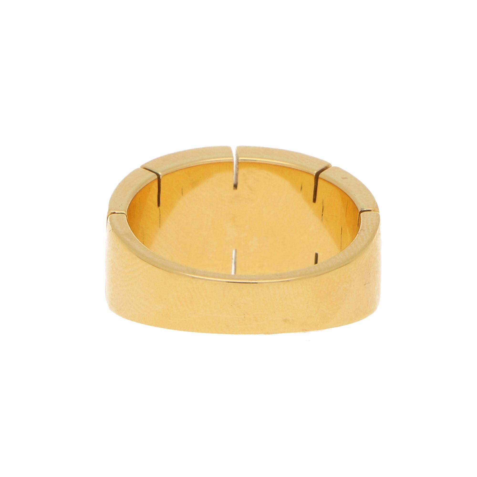 This Cartier Maillon Panthere diamond ring in 18 carat yellow gold is of a bombe design featuring the brand's Maillon Panthere motif, pave-set to the centre with nine round brilliant-cut diamonds. 

Currently a Cartier size 52 (UK: L, USA: 6)