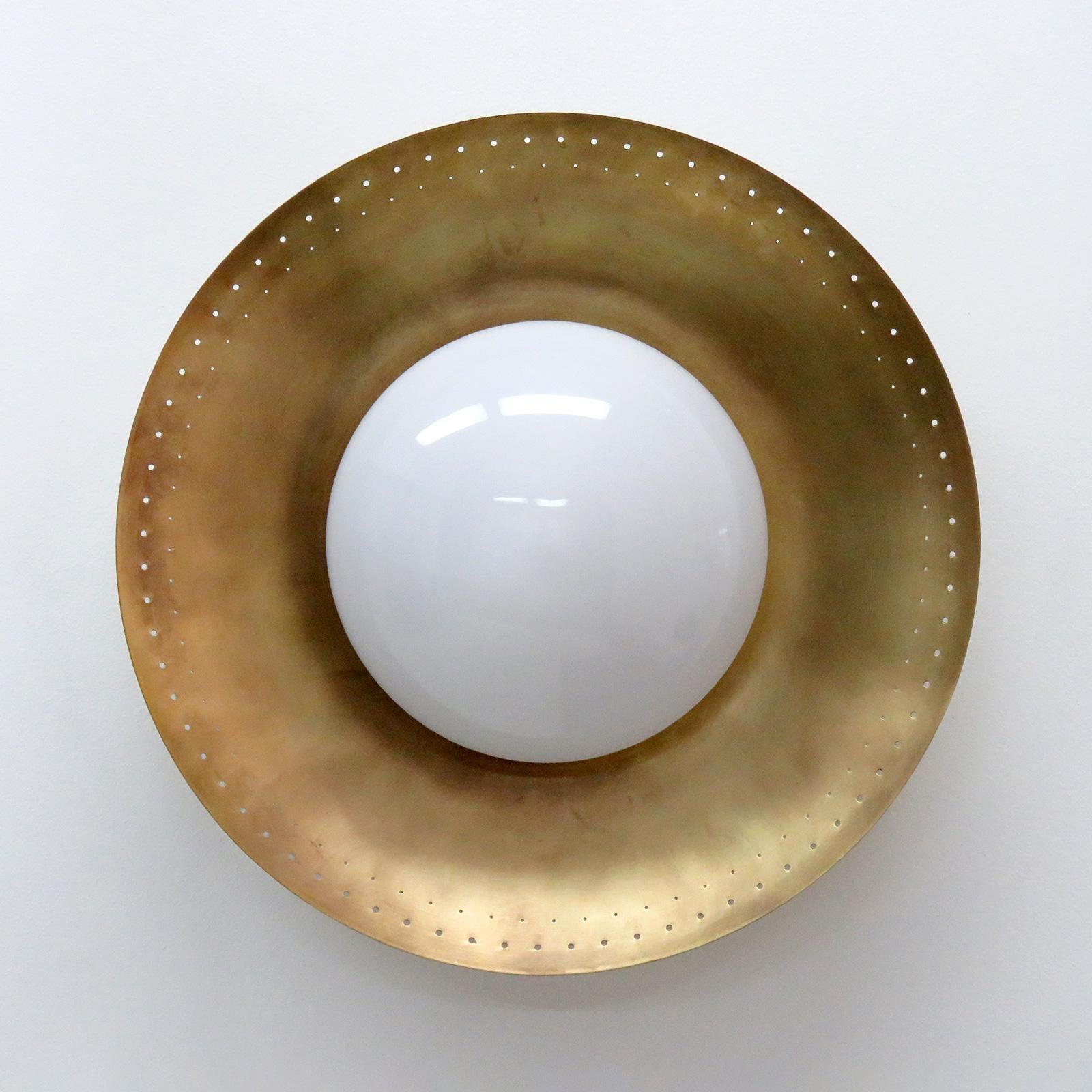 Elegant ‘Maine-18’ wall or ceiling light designed by Gallery L7, handcrafted and finished in Los Angeles from American brass, with an opaline glass shade on an aged raw brass perforated disc. One E26 socket per fixture, max. wattage 60w each or 3-7w