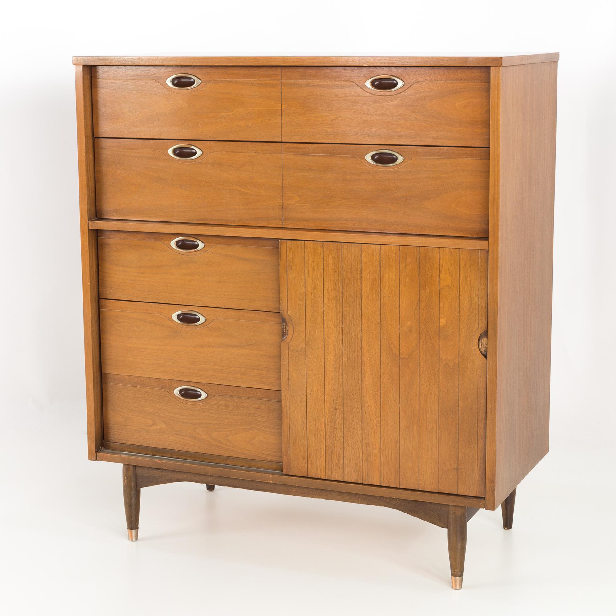 Mainline by Hooker 8 drawer mid century walnut highboy dresser
40 wide x 19 deep x 46 high

All pieces of furniture can be had in what we call restored vintage condition. That means the piece is restored upon purchase so it’s free of watermarks,