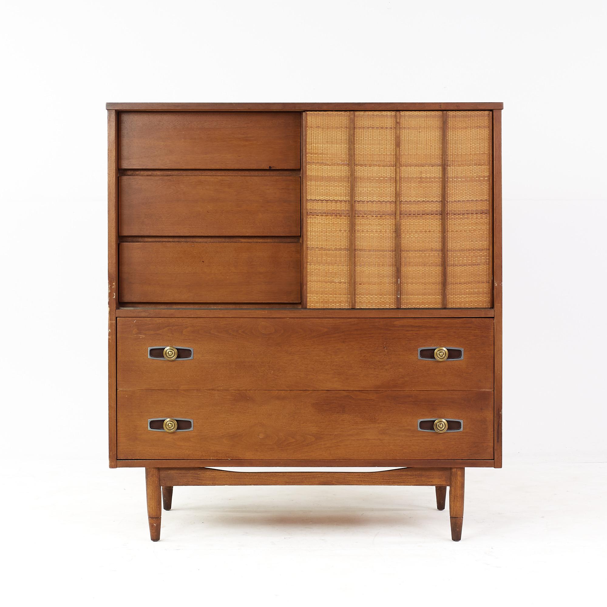 Mainline by Hooker mid century walnut and cane 8 drawer highboy dresser

This highboy dresser measures: 42 wide x 20 deep x 46.75 inches high

All pieces of furniture can be had in what we call restored vintage condition. That means the piece is