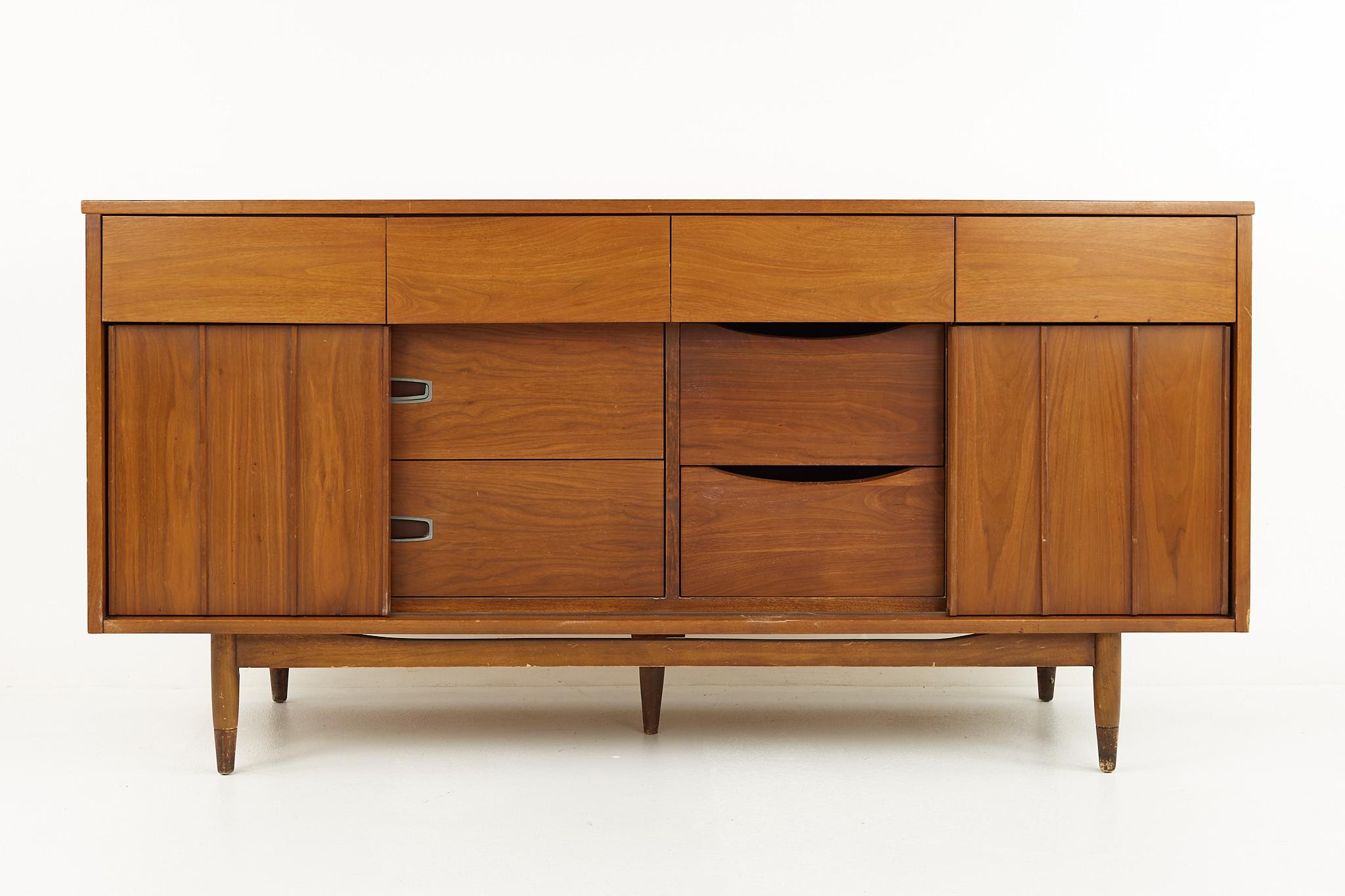 Mainline by Hooker mid century walnut and cane reversible door lowboy dresser

This dresser measures: 64 wide x 20 deep x 31.75 inches high

All pieces of furniture can be had in what we call restored vintage condition. That means the piece is