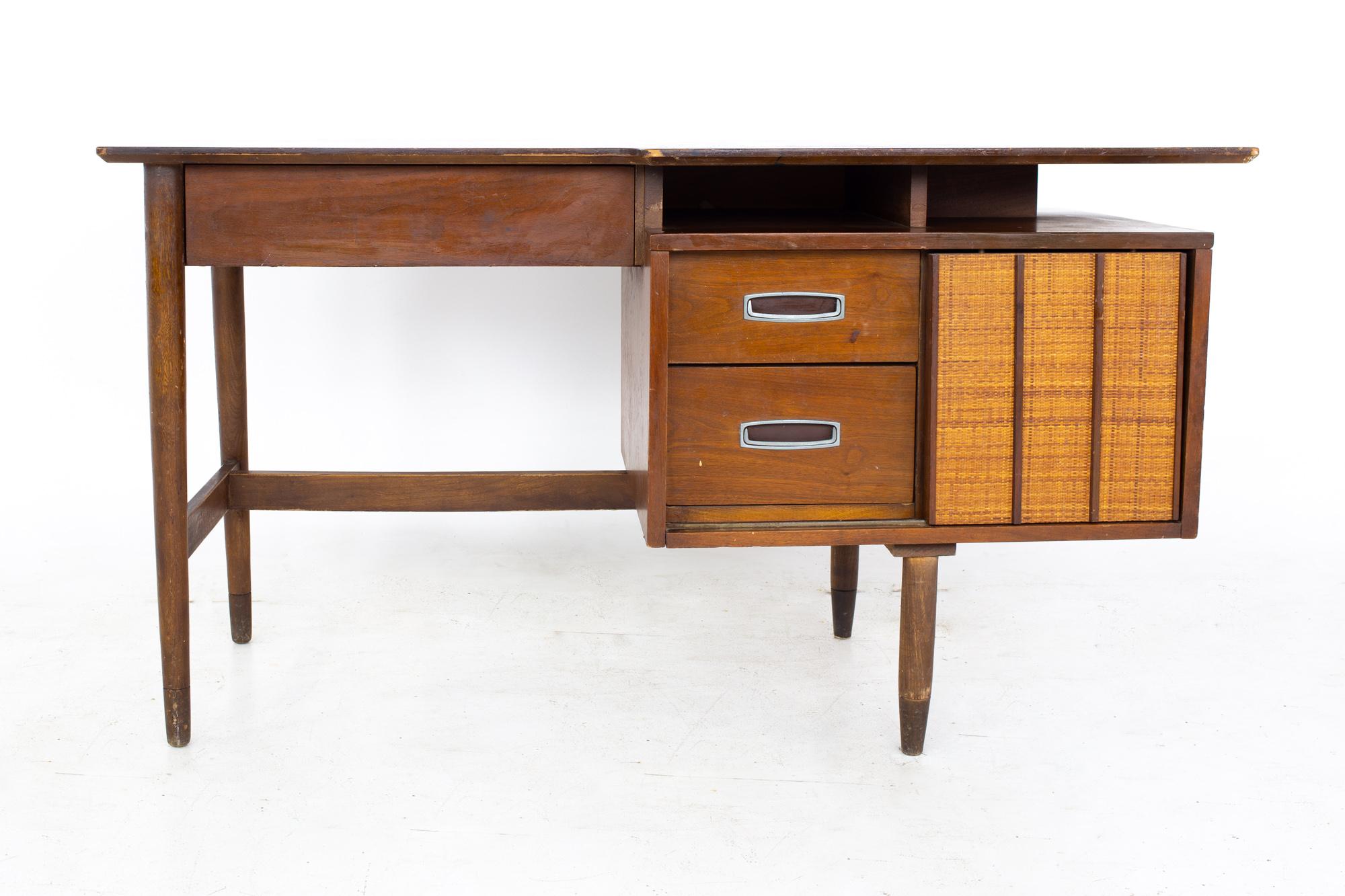 Mainline by Hooker Mid Century walnut and rattan reversible door floating desk
Desk measures: 54 wide x 25 deep x 29.75 inches high, with a chair clearance of 24 inches 

All pieces of furniture can be had in what we call restored vintage