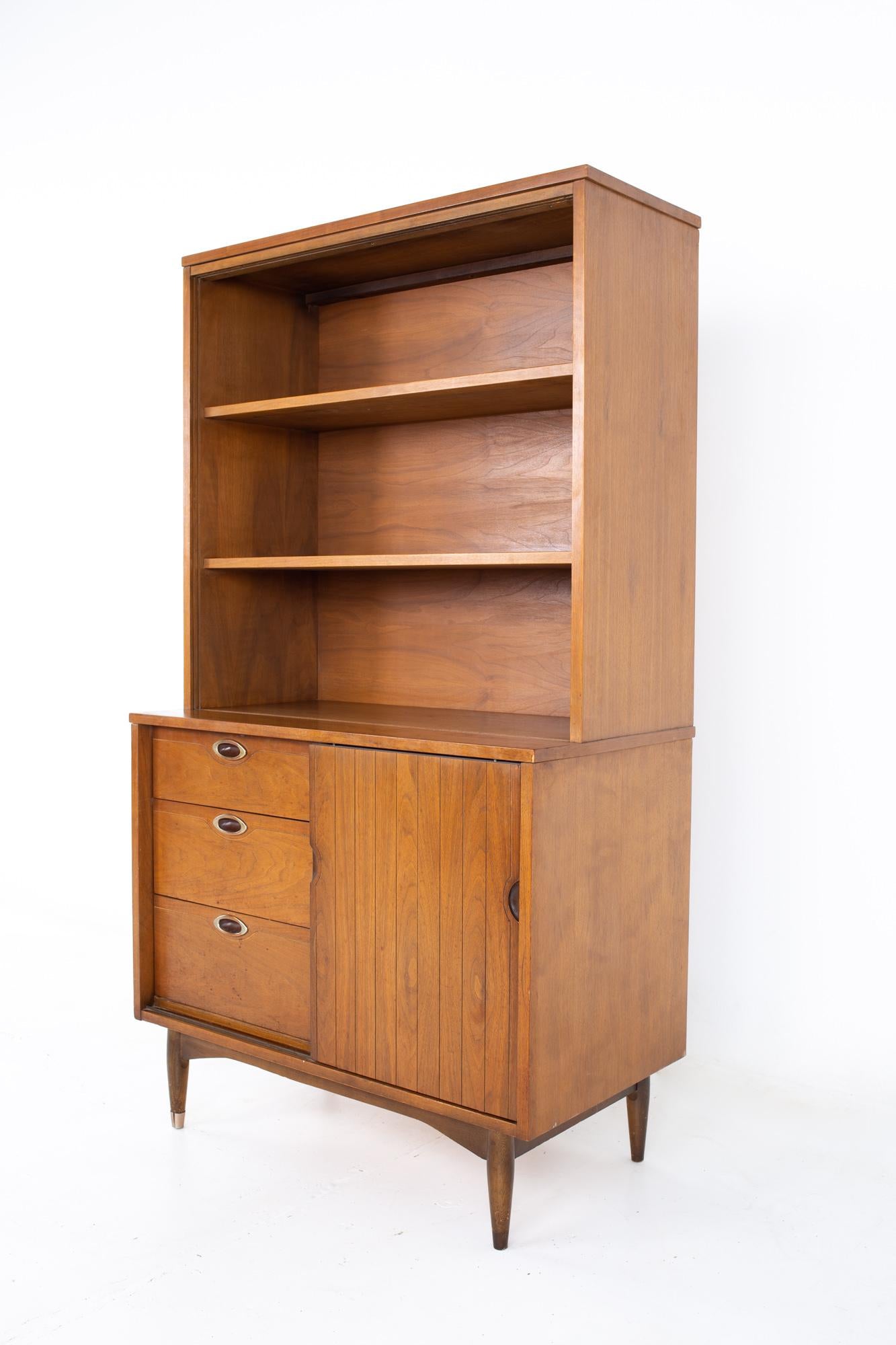 Mainline by Hooker mid century walnut buffet and hutch
Buffet and hutch measure: 36 wide x 19 deep x 64.5 inches high

All pieces of furniture can be had in what we call restored vintage condition. That means the piece is restored upon purchase