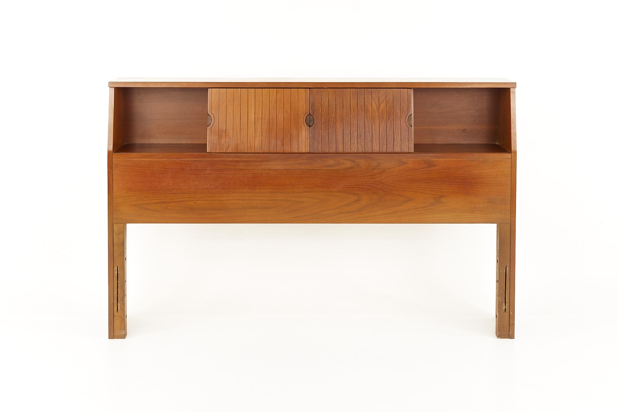 Mainline by Hooker Mid Century walnut full storage headboard

This headboard measures: 57.25 wide x 9 deep x 36 inches high

All pieces of furniture can be had in what we call restored vintage condition. That means the piece is restored upon