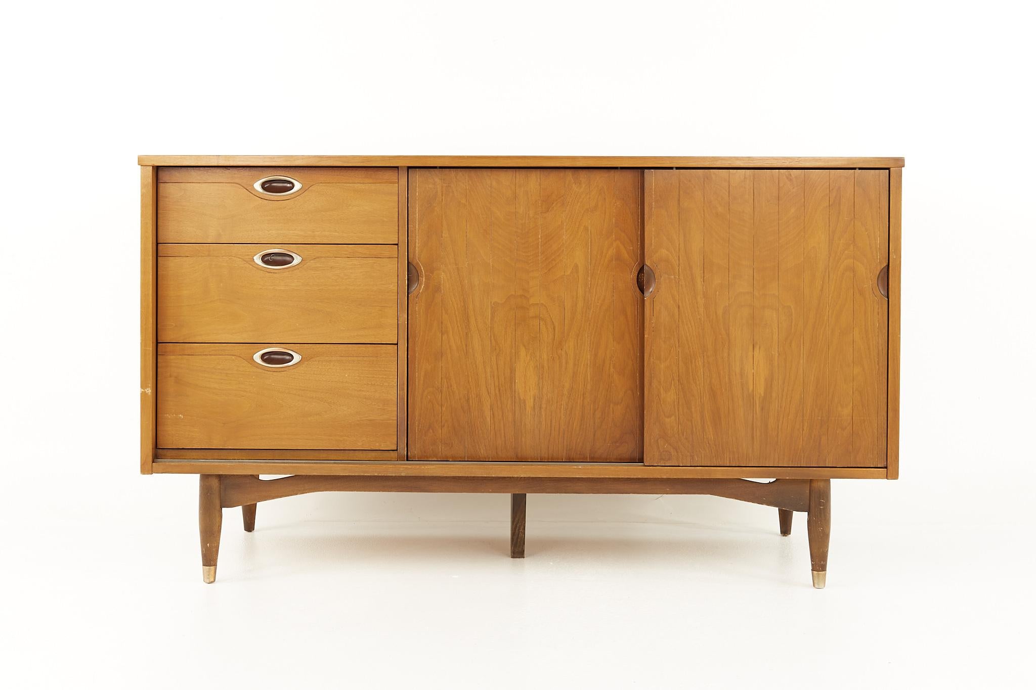 Mainline by Hooker mid century walnut sliding door credenza

This credenza measures: 54 wide x 19 deep x 30.75 inches high

All pieces of furniture can be had in what we call restored vintage condition. That means the piece is restored upon