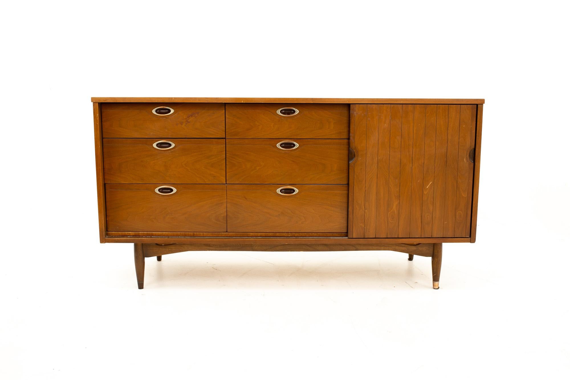 Mainline by Hooker Mid Century walnut 9-drawer lowboy dresser
Dresser measures: 60.5 wide x 19.5 deep x 30.5 high

All pieces of furniture can be had in what we call restored vintage condition. That means the piece is restored upon purchase so it’s