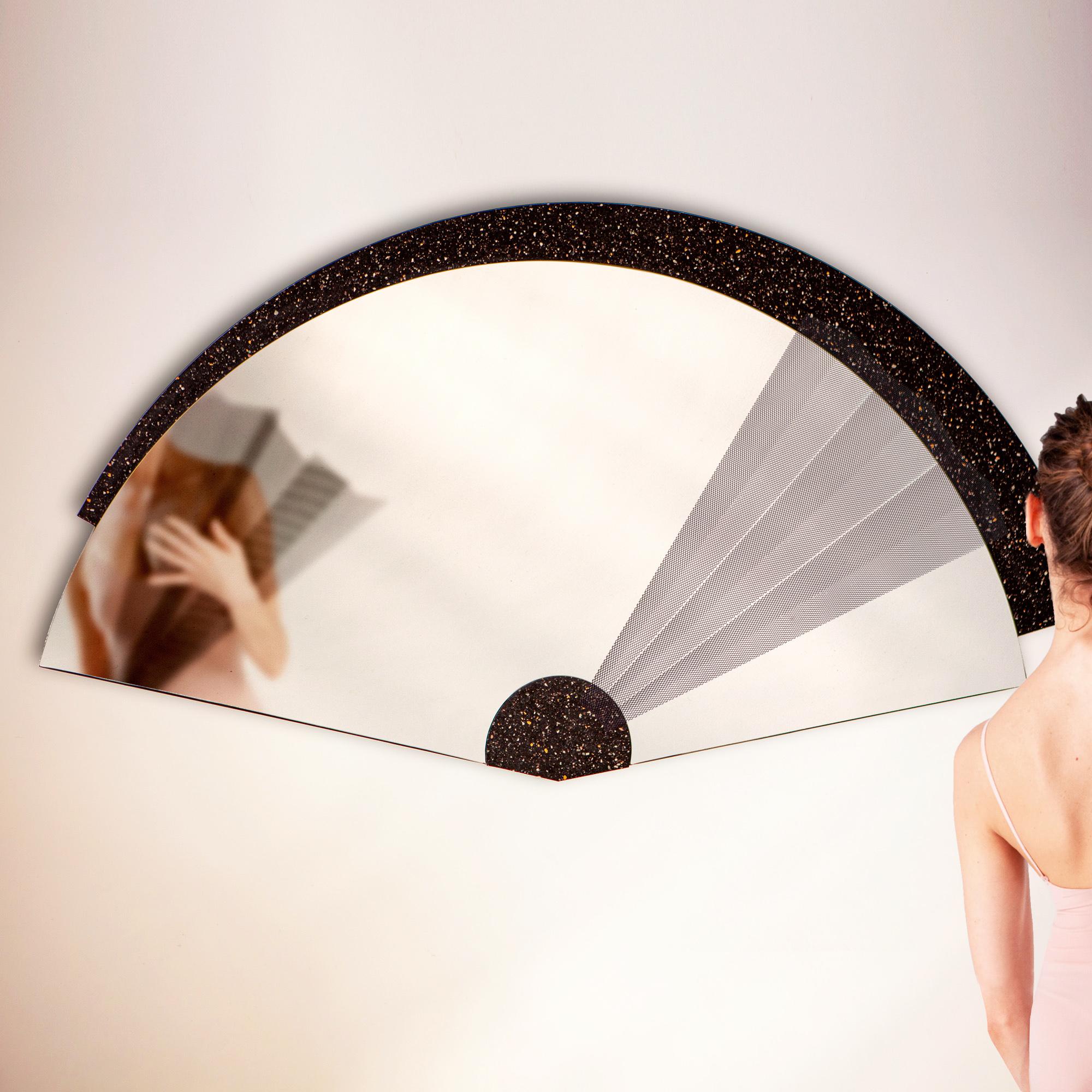 Maiohgi is a fan-shaped wall mirror inspired by the Japanese tradition, whose surface rests on a black stone insert that recalls stars on a black sky. Created by Jacobsroom Studio in Rome, the accessory is completed by six magnetic segments in very