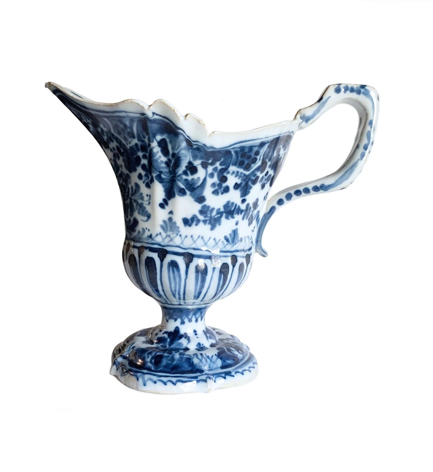 Majolica pitcher
Antonio Maria Coppellotti Manufacture
Lodi, circa 1735 
Majolica decorated in cobalt blue monochrome
It measures 7.36 in hight x 8.07 x 4.52 (h 18.7 cm x 20.5 x 11.5)
Weight:  0.859 lb (390 g)

State of conservation: intact, apart