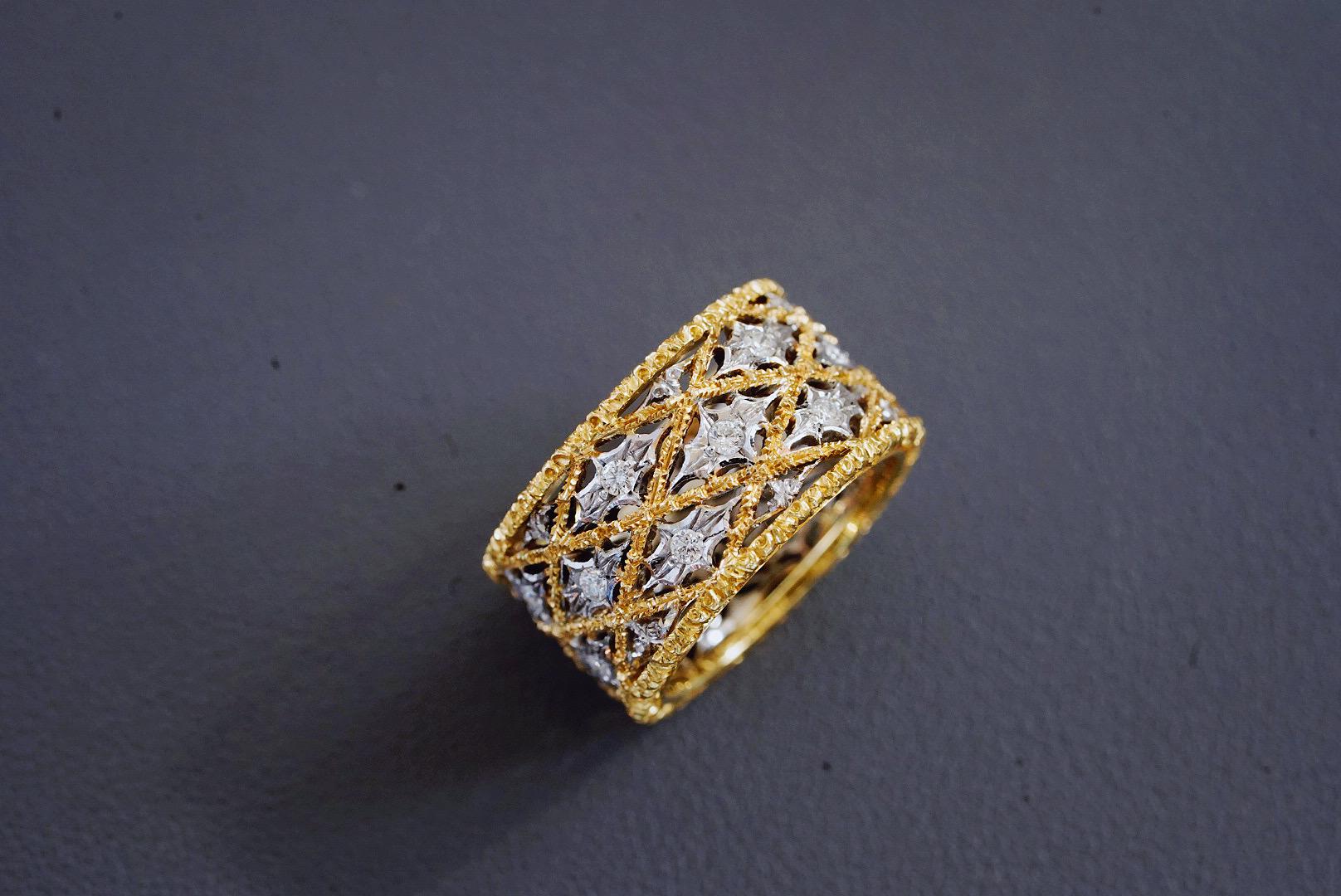 This exquisite vintage and very typical diamond band ring from Mairo Buccellati, is masterfully handcrafted with a beautiful feminine look.  Having been inspired by the Renaissance period, its natural elements have been stylised into geometric