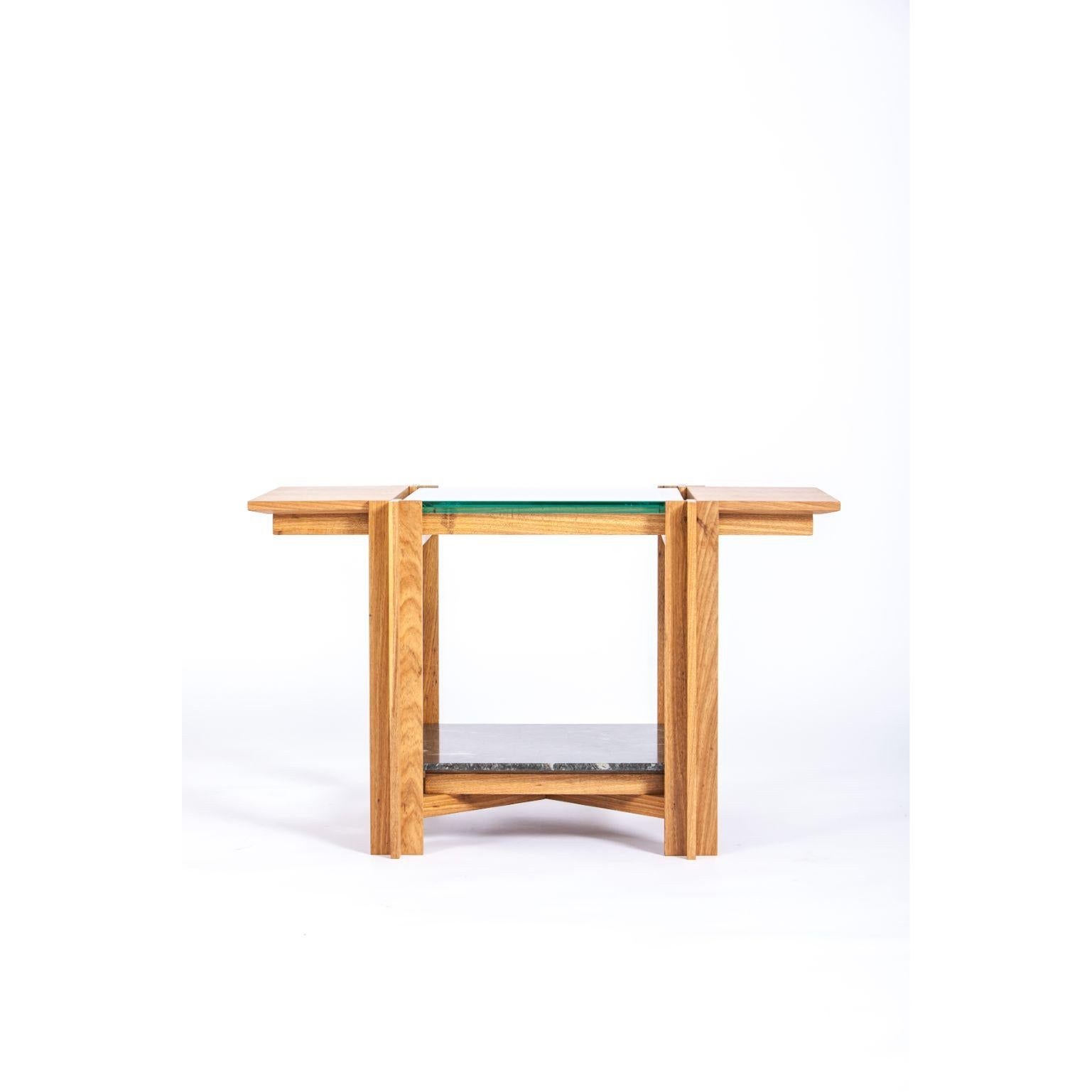 Mais - light freijo table with tabs - by Alva Design
Materials: Natural or darkened freijó + glass + granite (floral sandblasted green)
Dimensions: 83 x 49 x 50 cm

Alva is a furniture and objects design office, formed by brothers Susana Bastos,