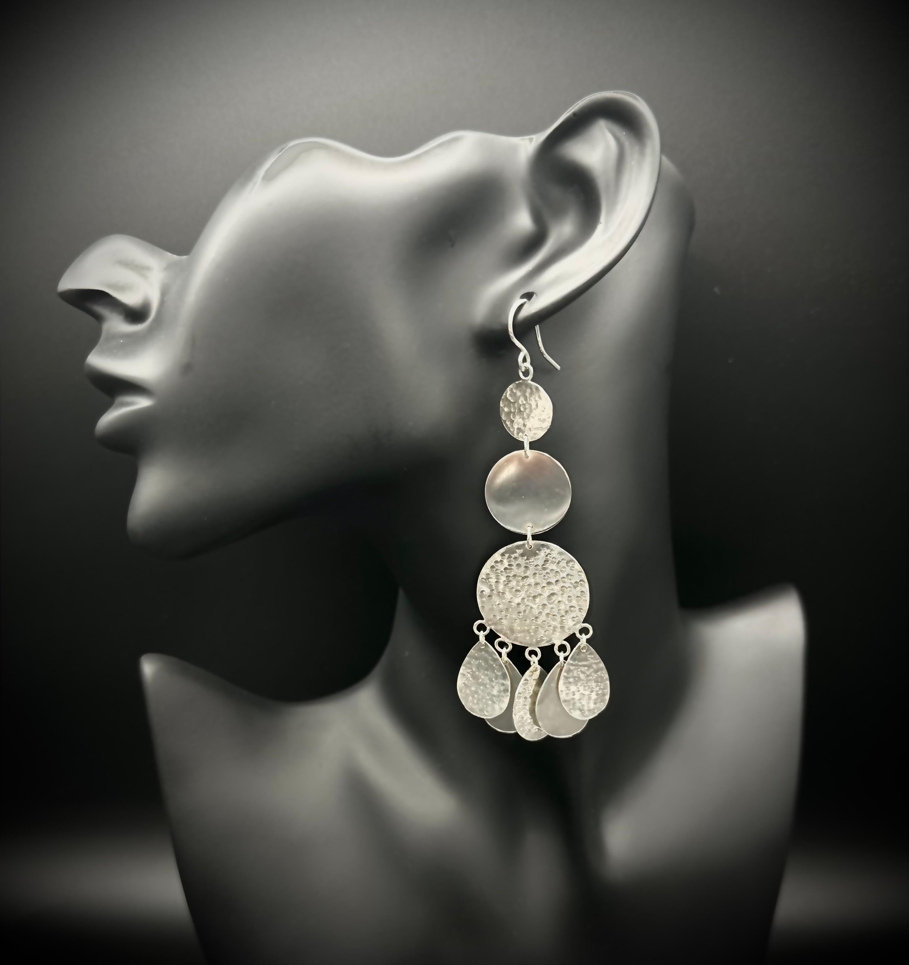 -Handmade
-Sterling silver
-Stamped with Nebu  logo
-95mm

Introducing our striking handmade earrings, designed to make a statement. Measuring 95mm in length, these elegant pieces are aptly named 