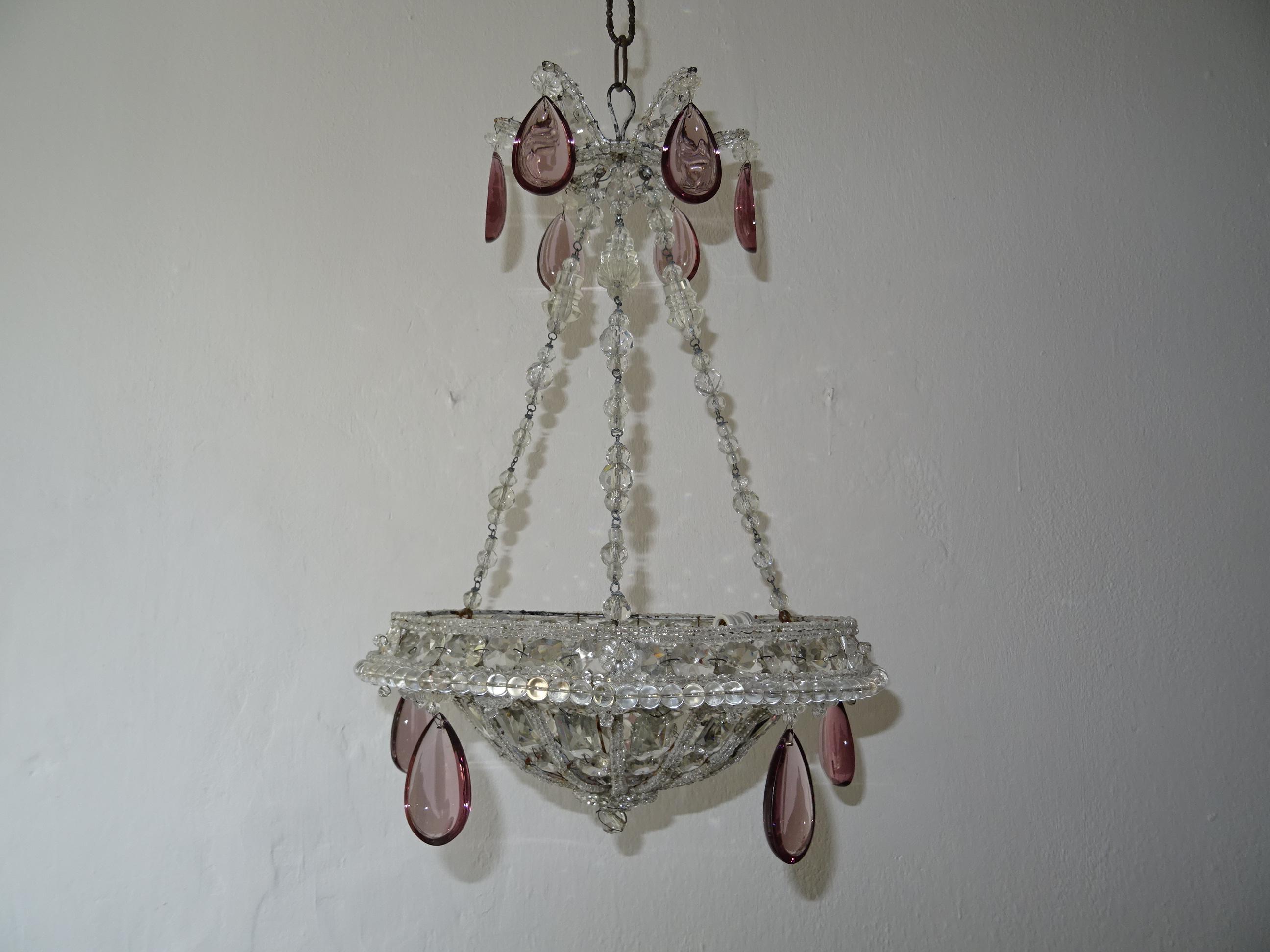 Housing 3 lights, will be newly rewired with certified US UL sockets for the USA and appropriate socket for all other countries. A rare example of Maison Baguès. So many crystal beads and prisms in all different sizes and shapes. Beaded throughout,