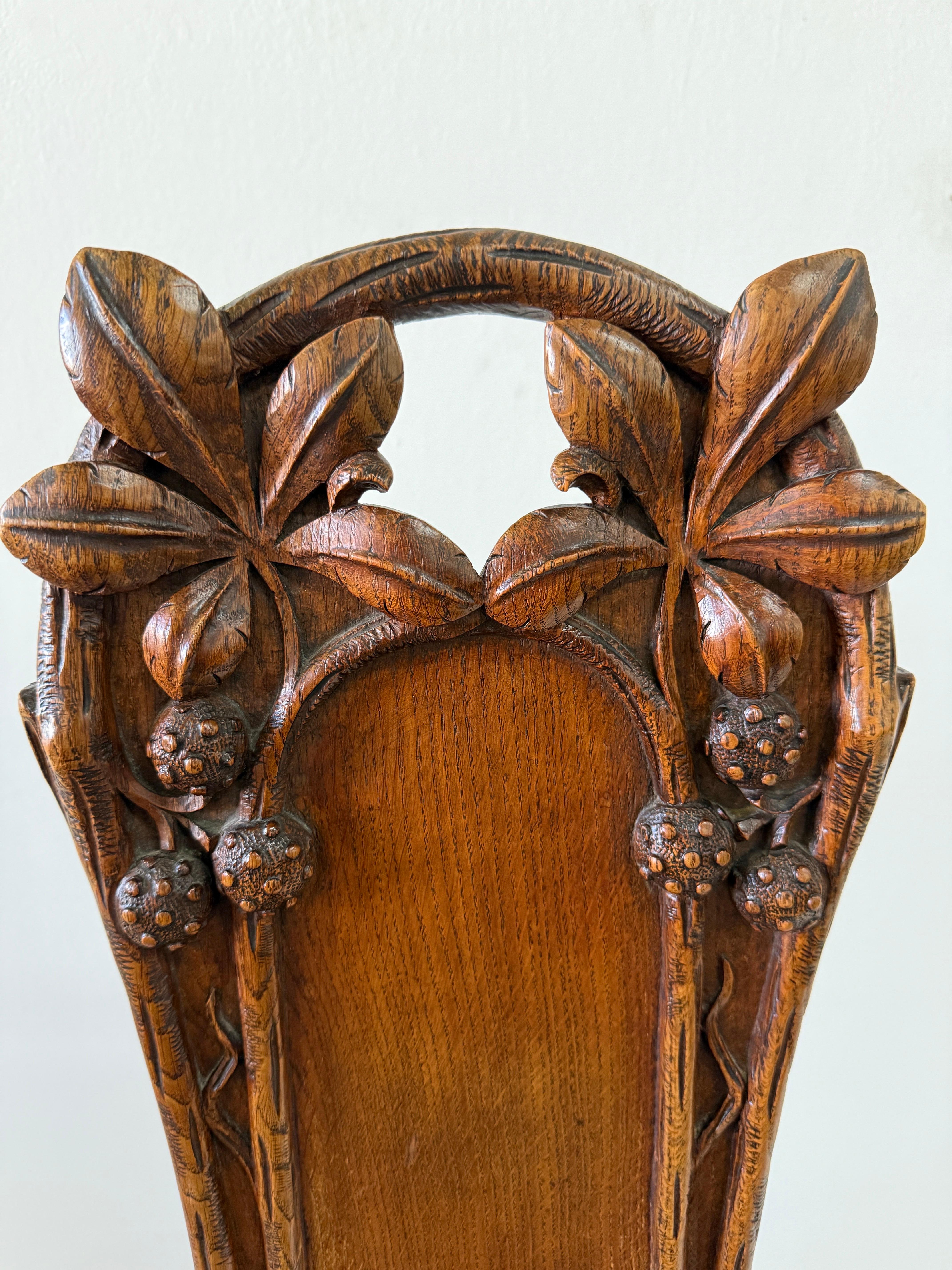 Hand-Carved Maison Antoine Bastet Antique Carved Oak Hall Side Chairs, Pair For Sale