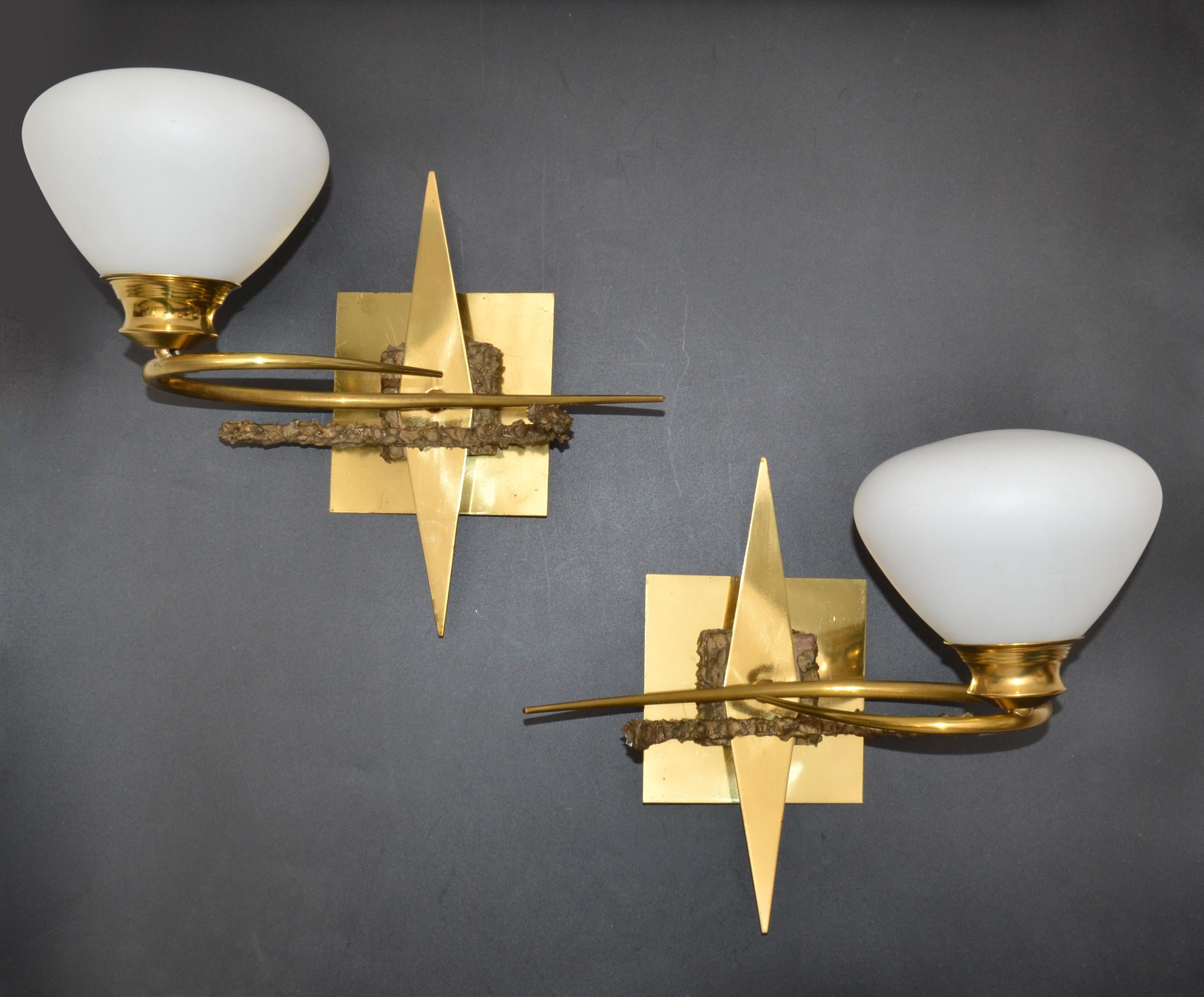 French Mid-Century Modern sconces in brass and bronze detail with original opaline glass shade designed by Maison Arlus and made in the 1960.
Perfect working condition and each wall lamp takes 1 lightbulb with max 25 watts, LED are working