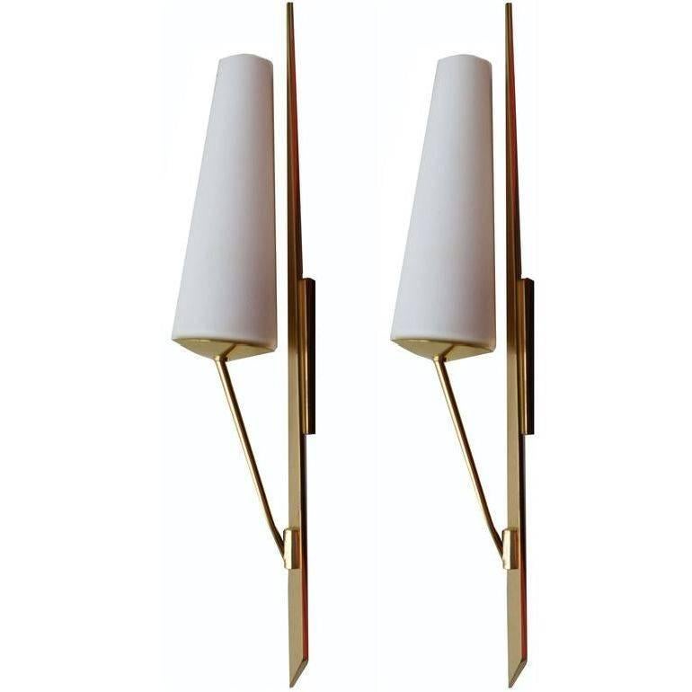 Very elegant pair of Maison Arlus sconces, wall lights made out of brass and opaline glass shades.
Three pairs available.
US rewired and in working condition. Each takes max 40 watts light bulb, LED work perfect.
Have a look on our impressive