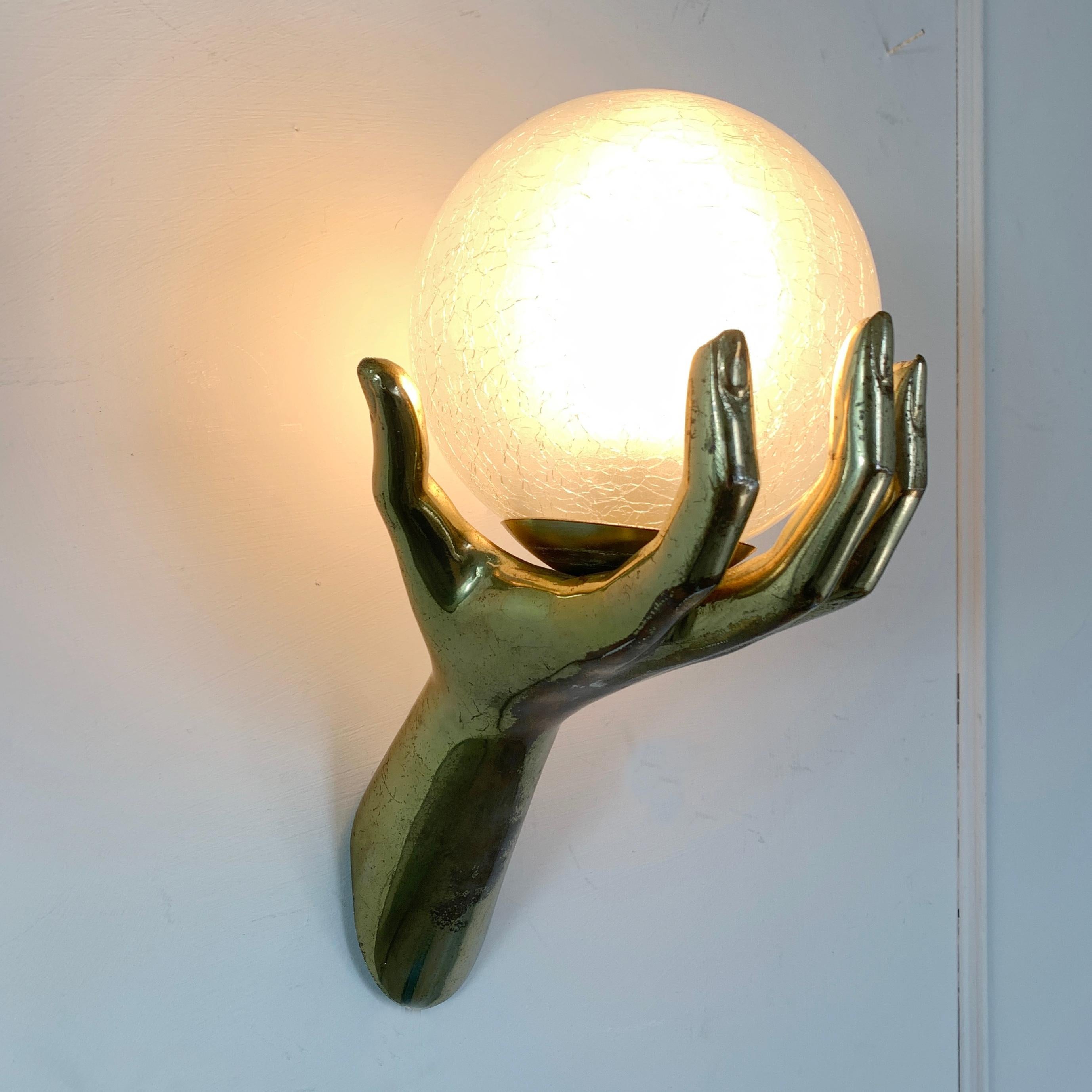 Maison Arlus bronze hand wall sconce
In superb original condition, with light signs of patina, and bearing the rare and original hand blown glass, open globe shade (these have usually been lost or damaged and replaced with modern opaque glass