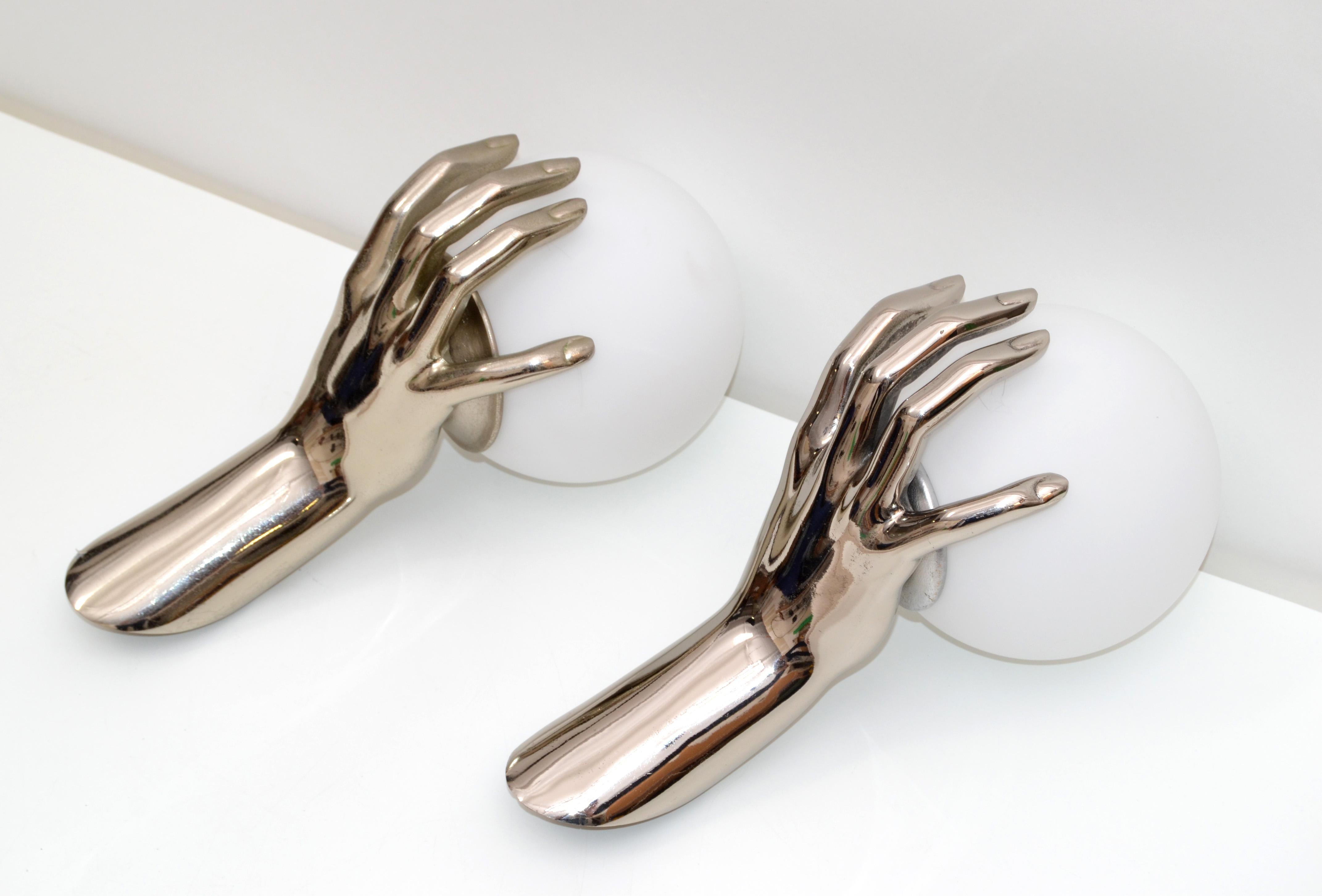 Very elegant pair of nickel plated silver patina hand sconces by Maison Arlus with white opaline glass shades coming from an apartment in Paris fully furnished with furniture and items designed by the most known French, circa 1970s designers. J.