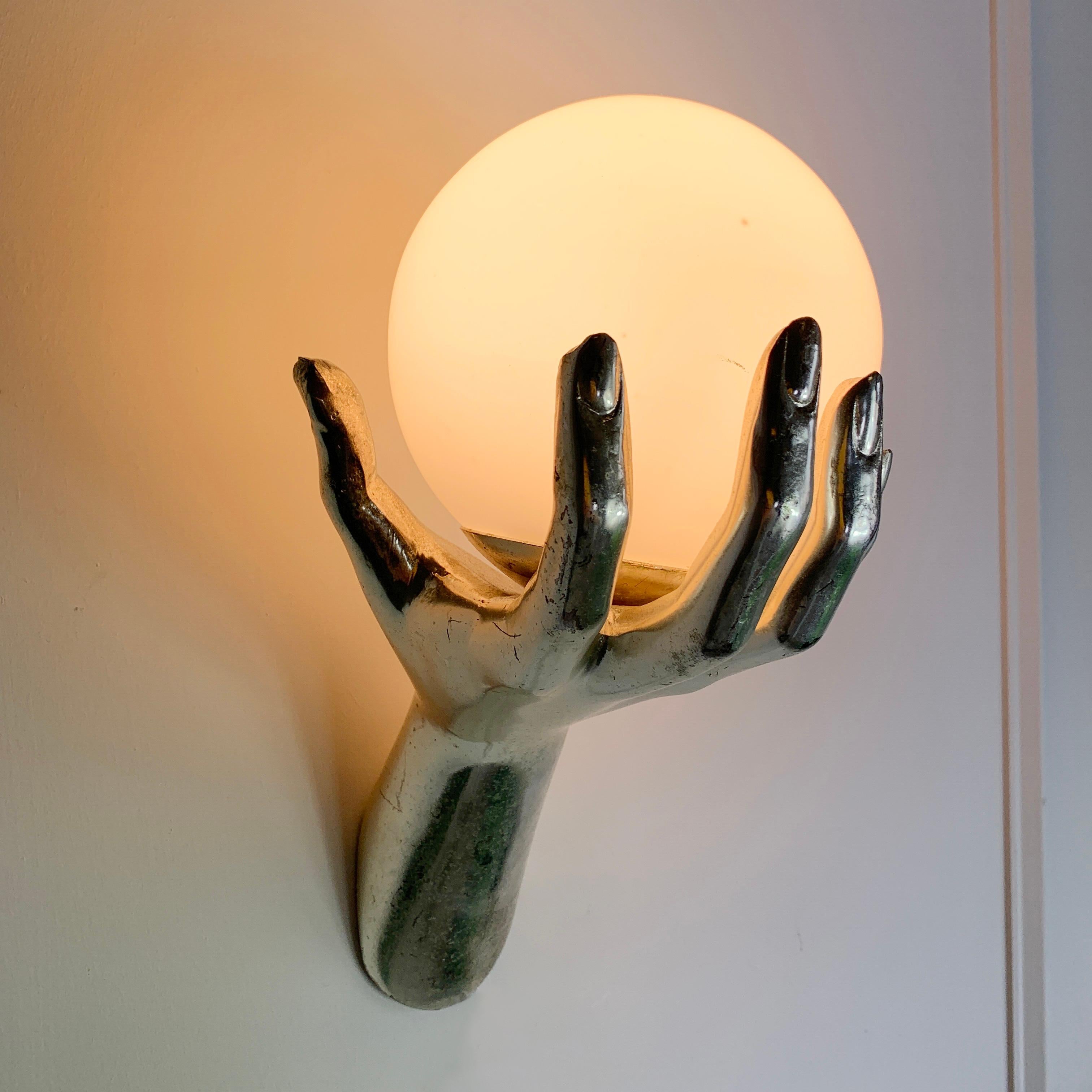 Maison Arlus bronze hand wall sconce

In superb original condition, with light signs of patina, and bearing the opaline original hand blown glass shade (these have usually been lost or damaged and replaced with modern glass globes) This piece has