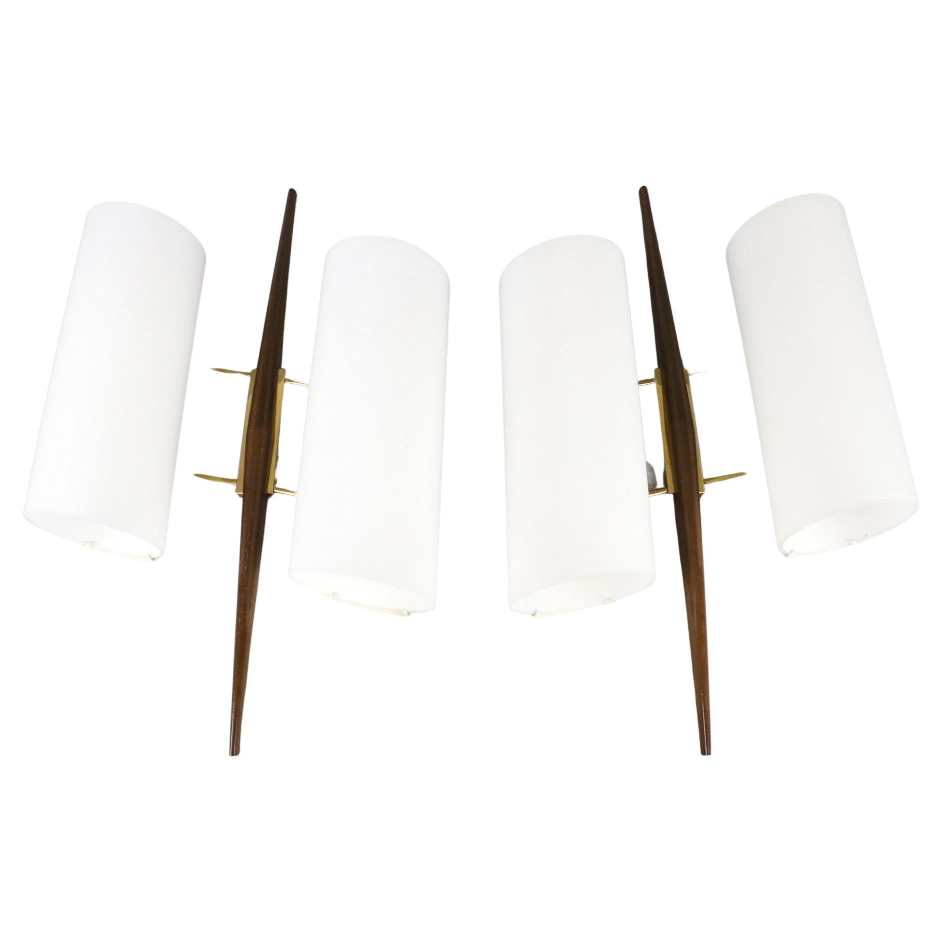 Maison Arlus, Pair of Mid-Century Modern Double lighting wall lamps, 1950s France

Beautiful and elegant pair of sconces in 1950s style. They are remarkable for their large size
In very good condition with normal wear of age.

Formal, sober and