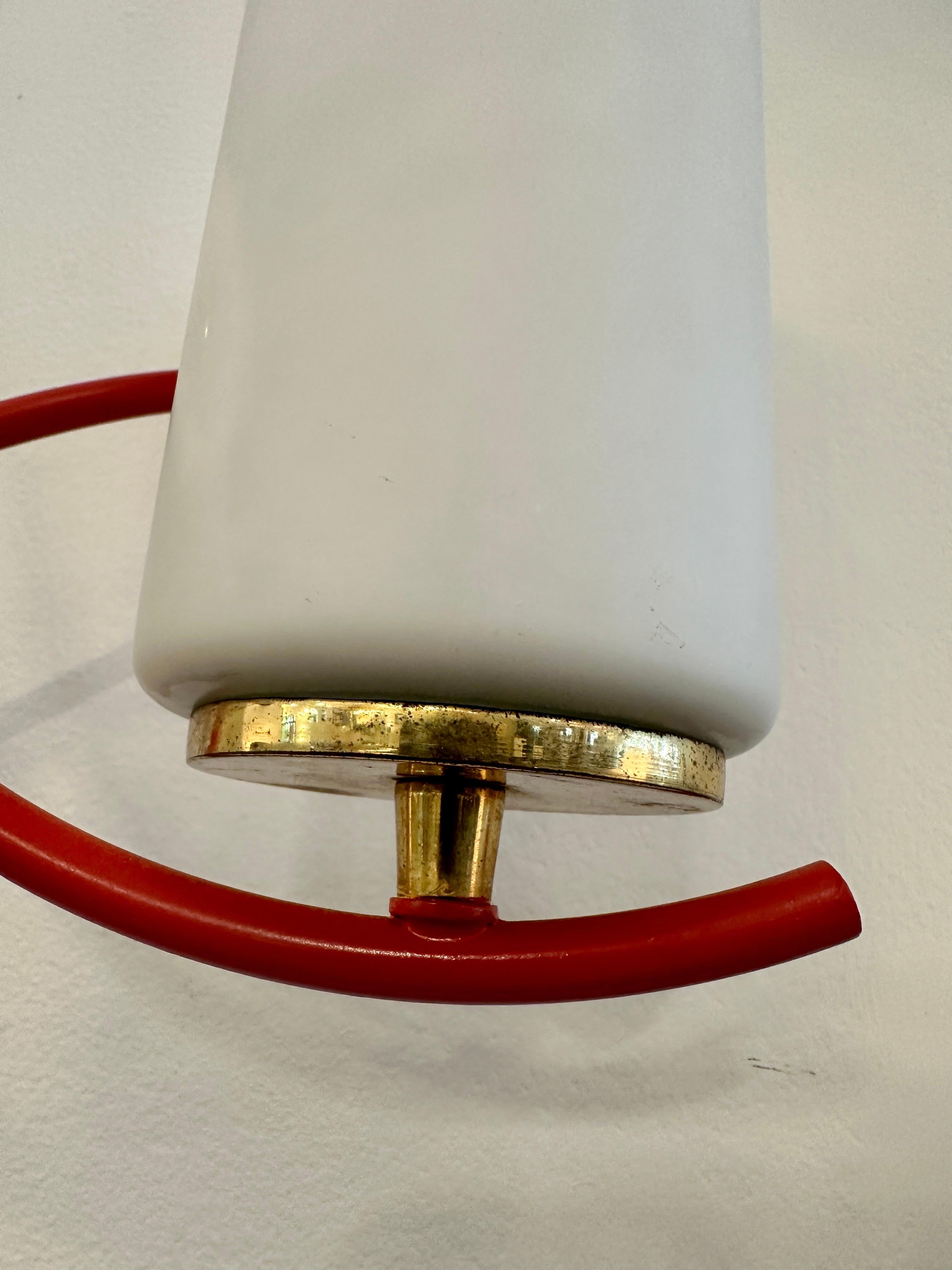 Pair of Maison Arlus cylindrical sconces, wall light with original cylinder Opaline shade, made out of steel with brass details.  Both are the same size and mirror image of each other, superb French Design from the 1960s.  THIS ITEM IS LOCATED AND