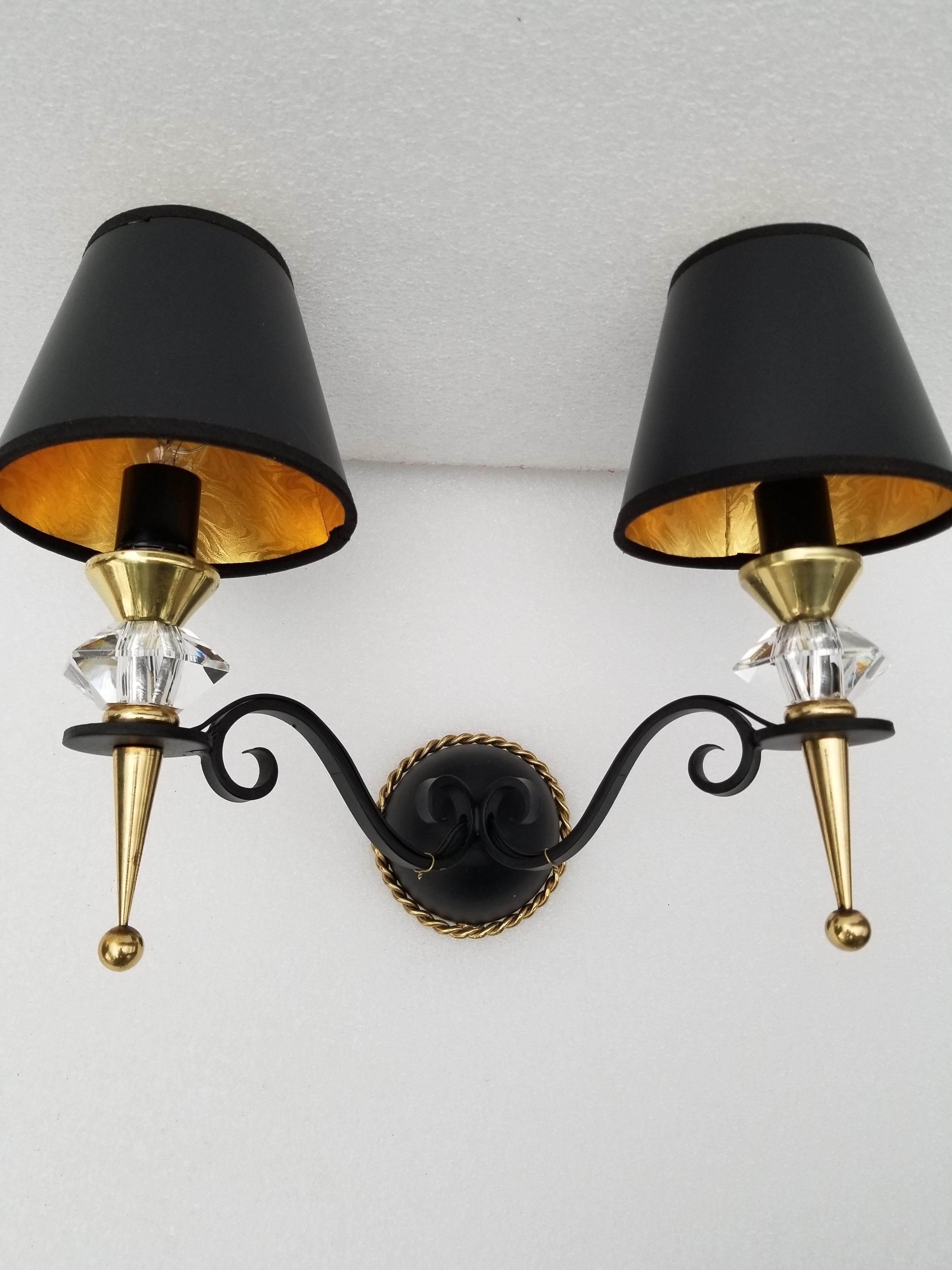 3 sconces by Maison Arlus, wrought iron, brass and crystal de Sèvres.
2 lights, 40 watts max bulb
US rewired and restored.
  