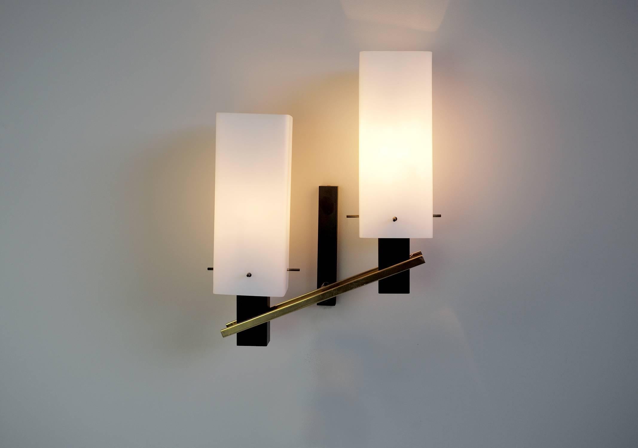 Large pair of two-light sconces in matte black metal, brass and opaline, Maison Arlus, France, 1960. Very good quality of manufacture at the service of a sober and elegant design. Perfect original condition.