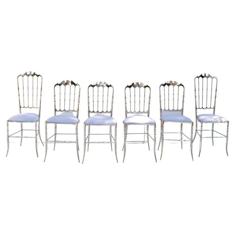 Exceptional set of six Italian nickel-plated over Brass Chiavari chairs.
Consisting out of 4 Dining Chairs and 2 high back Side Chairs.
New light violet silk upholstery.
Similar chairs are at the 
