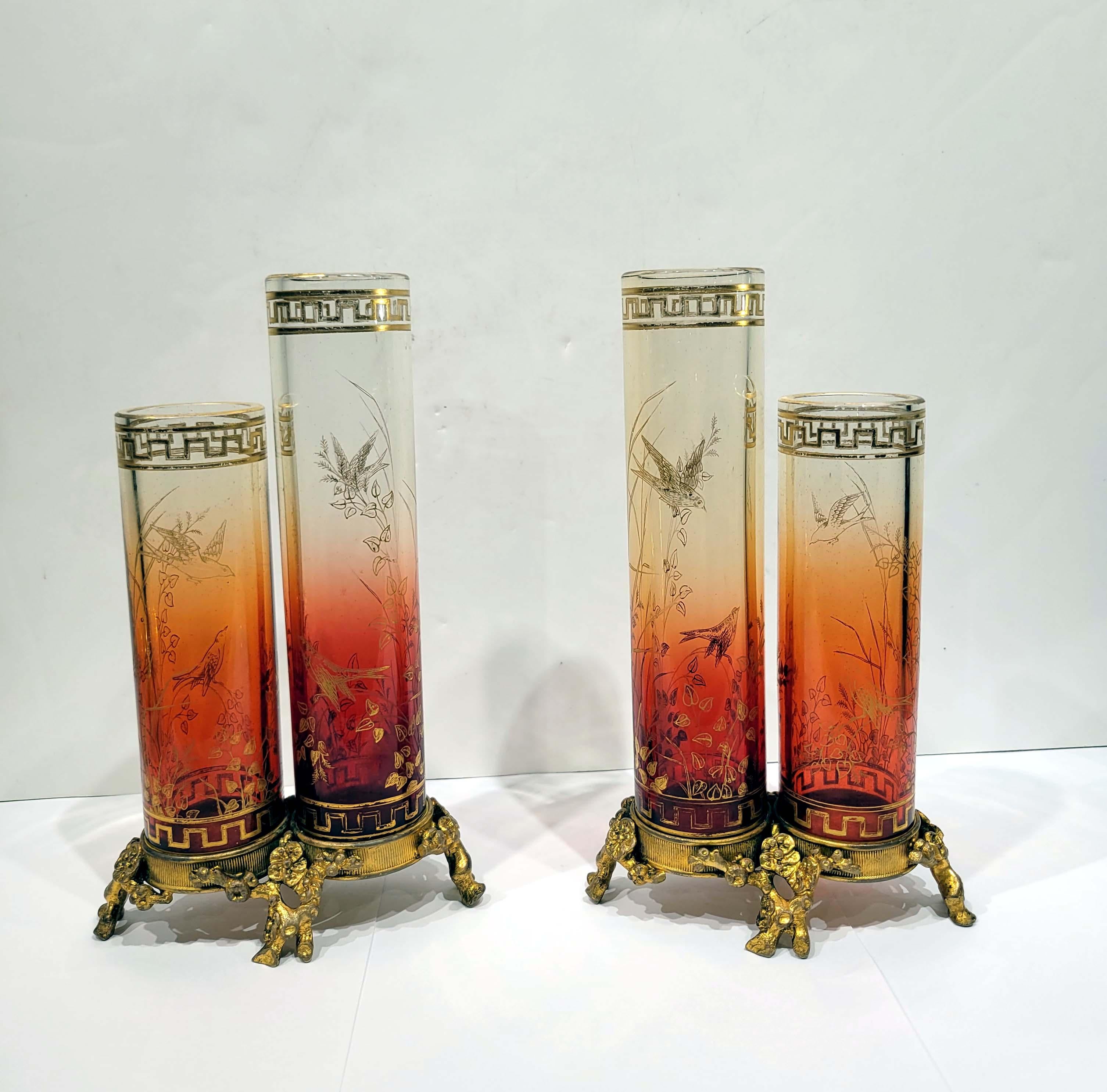 A magnificent pair of Baccarat Japonisme double cylindrical gold decorated glass vases mounted on Japanese style gilt bronze bases. The bronze bears Baccarat signature under the base.