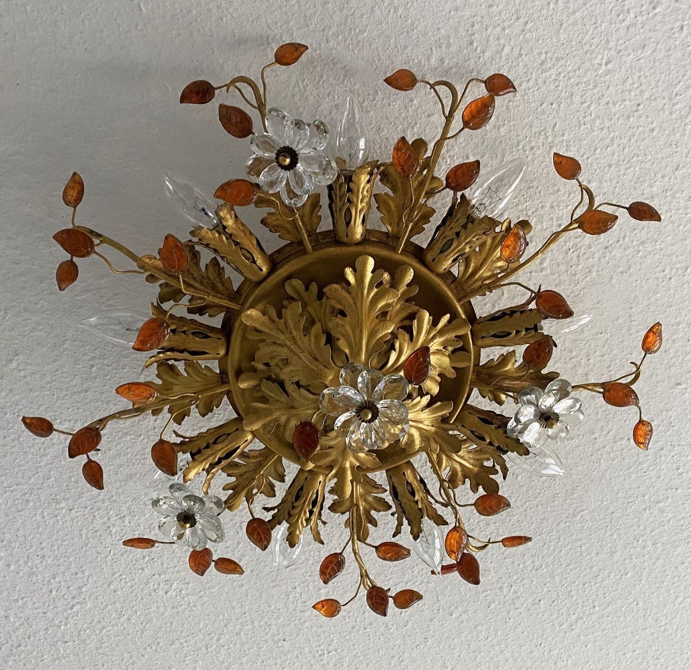 Large gilt Iron and crystal nine-Light flush mount by Maison Baguès, France, 1940s. Wonderful art environment handcrafted in iron gild with gold leaf beautifuly decorate with amber glass leaves and clear crystal double flowers. The amber color of