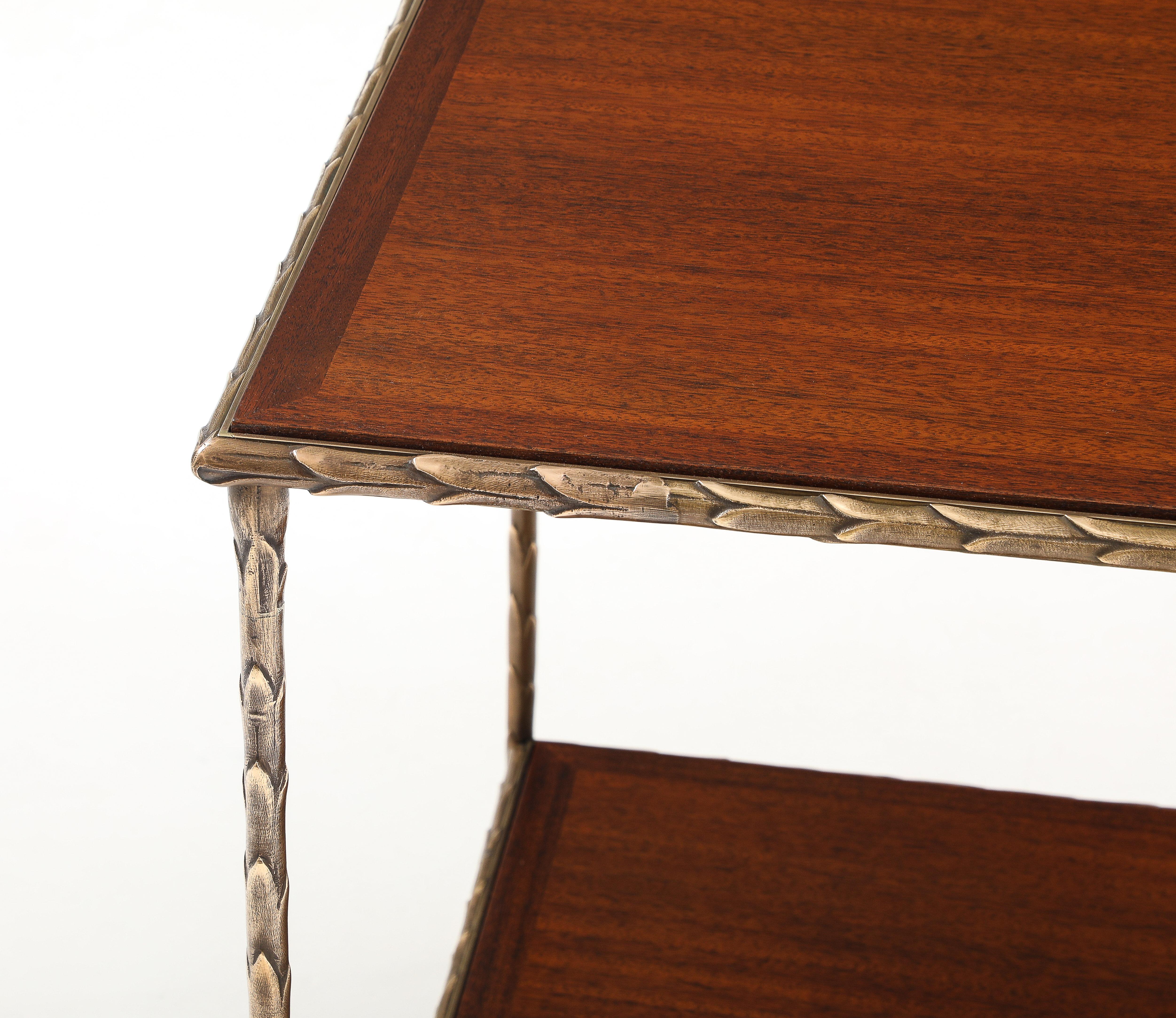 Beautiful 1960's Maison Baguès attributed two tier large bronze and mahogany large side table, fully restored the bronze has been lightly hand polished, with minor wear and patina due to age and use.