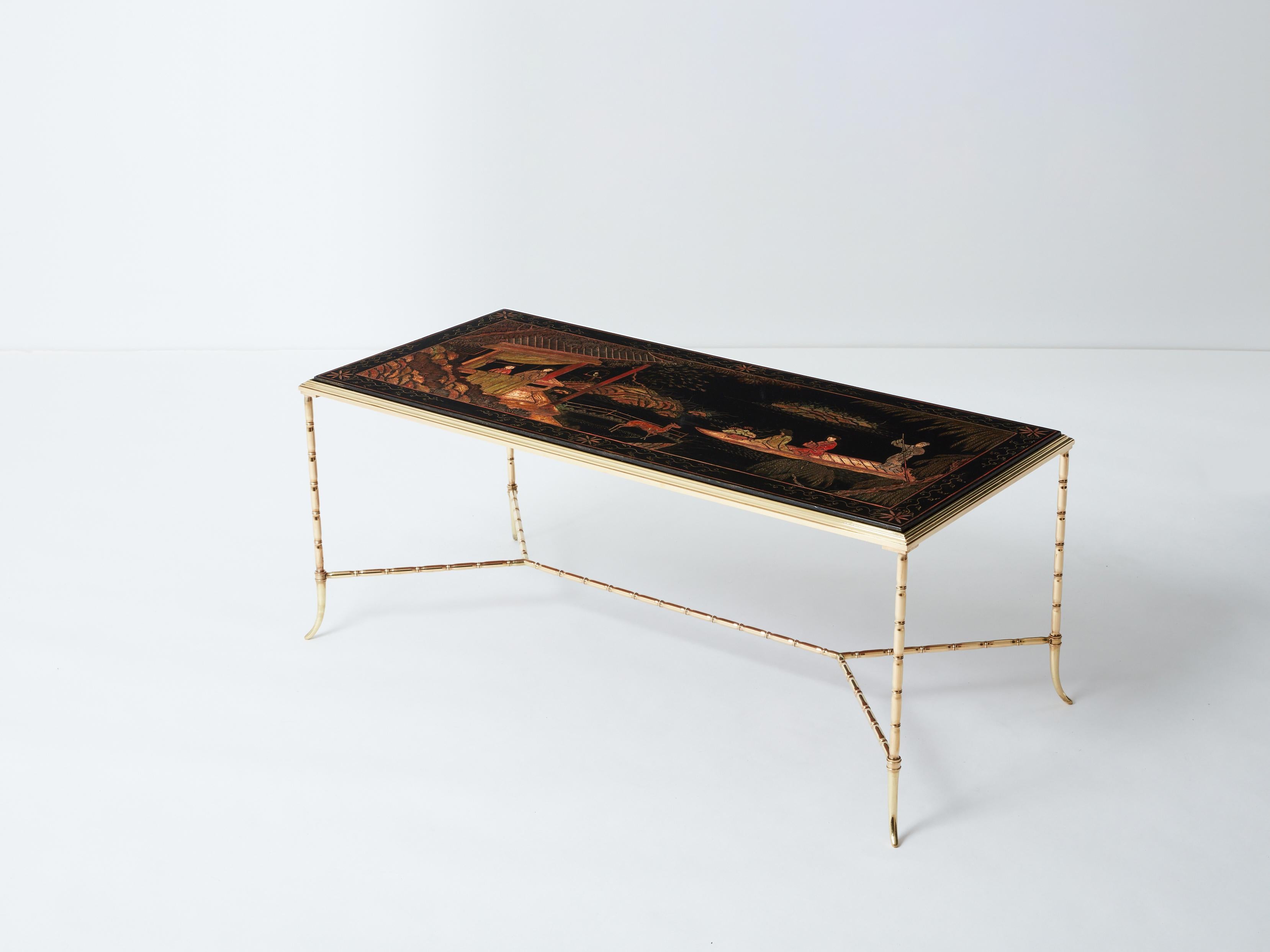 This coffee table by French house Maison Baguès was created in the early 1960s with solid bamboo shaped brass structure and a beautiful Chinese lacquered top picturing an ancient scenery inside a park. The lacquered top is warm and beautiful, while