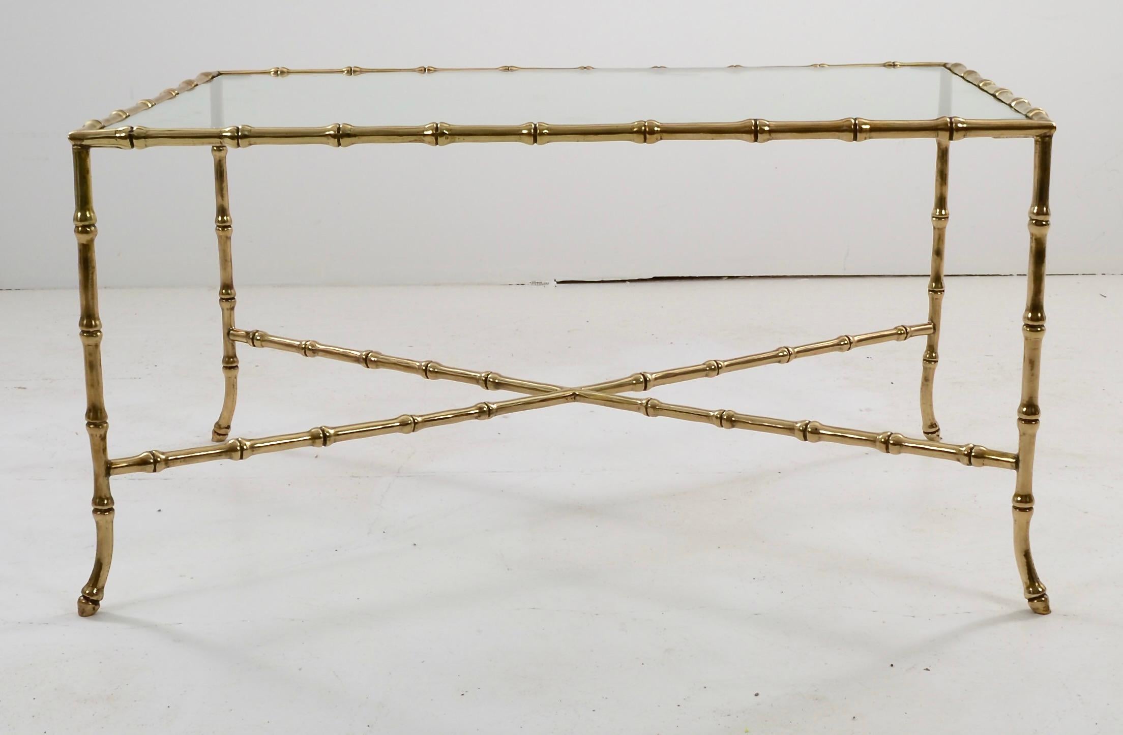 Super fine quality on the Maison Bagues table, newly polished and lacquered, all new glass top. Lovely proportions with slightly flared legs. Unusual, smaller size.  